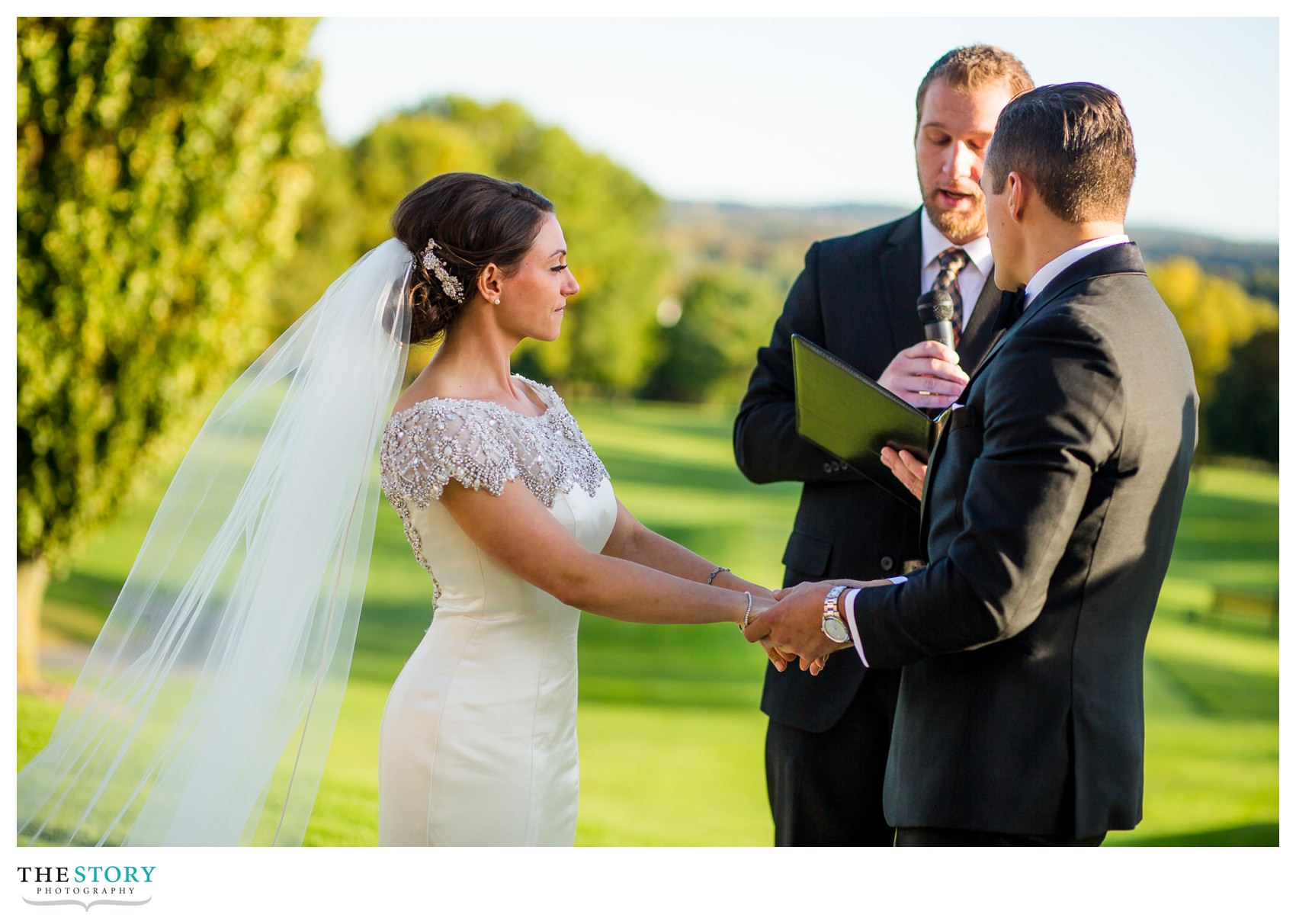 bride and groom holding hands at Onondaga Country Club wedding