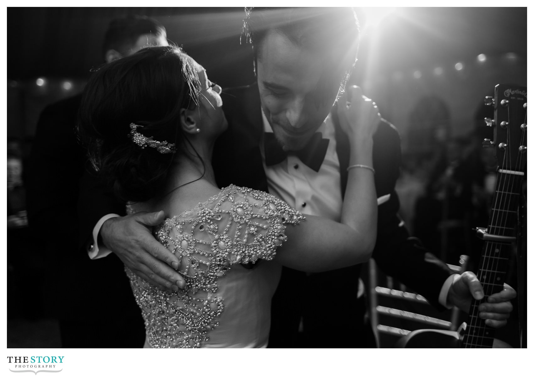 bride hugging groom's brother after the first dance at Onondaga Country Club wedding