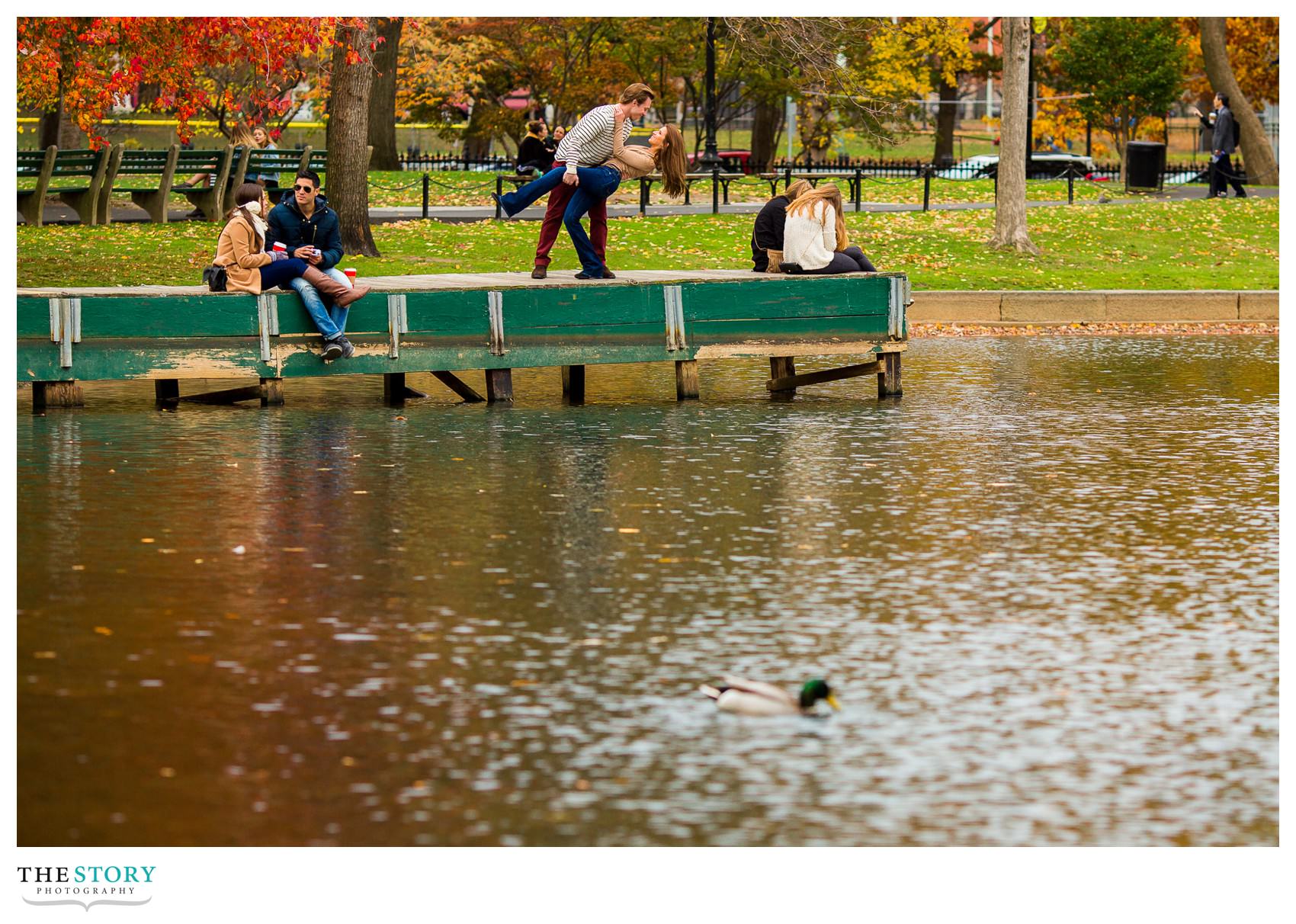 engagement photo on dock at Boston Public Garden