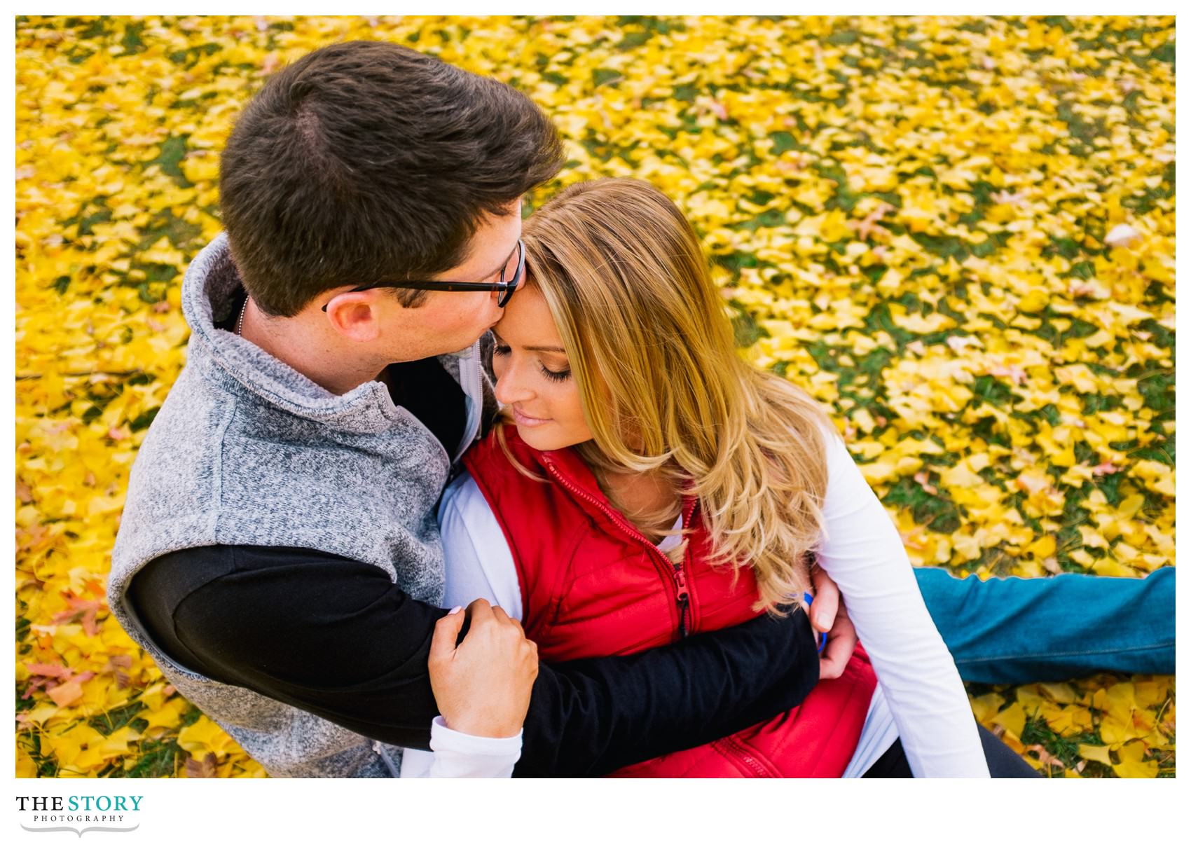 unique engagement photos in Boston Public Garden with fall leaves