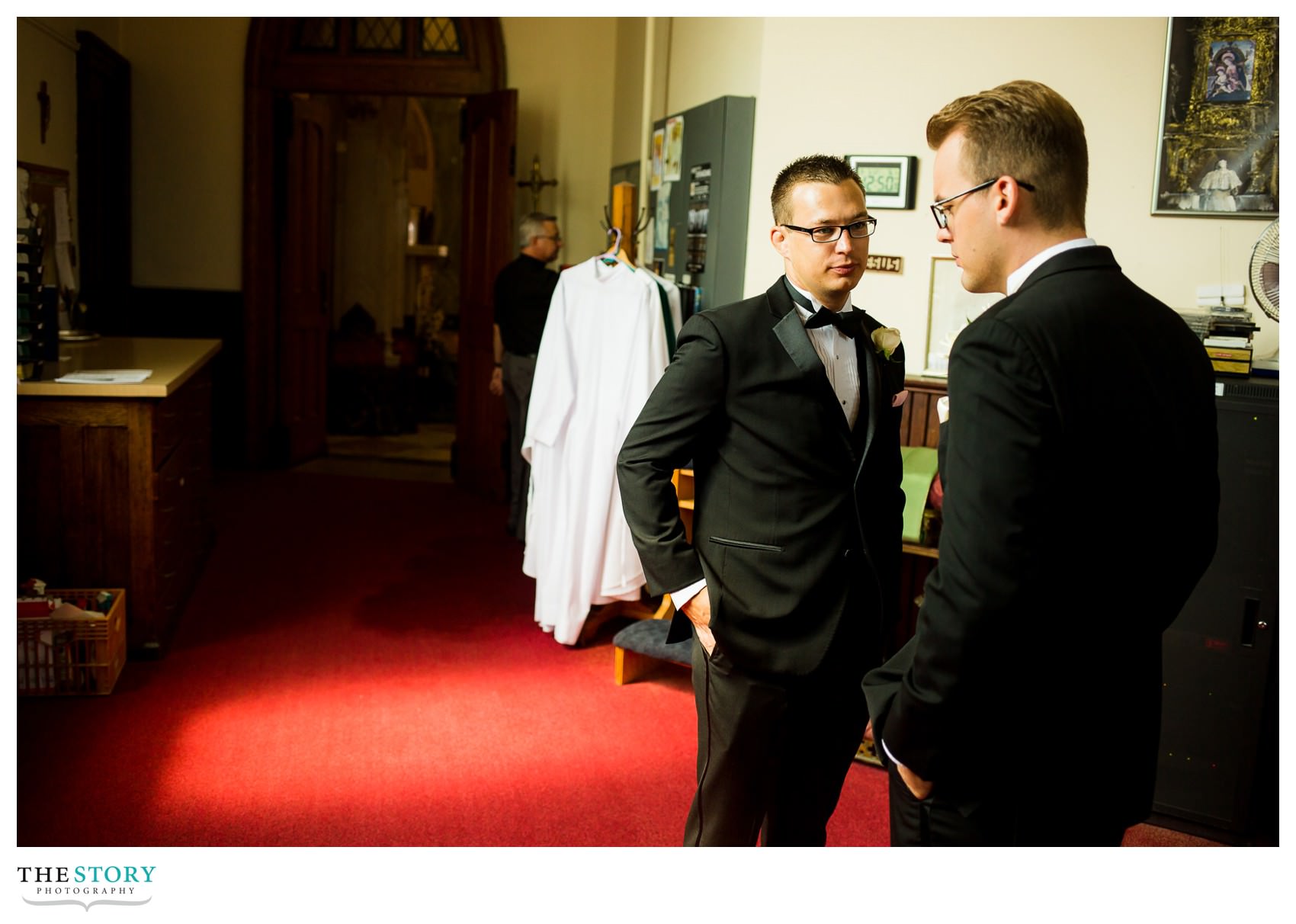 groom and best man before wedding ceremony at Sacred Heart Basilica in Syracuse