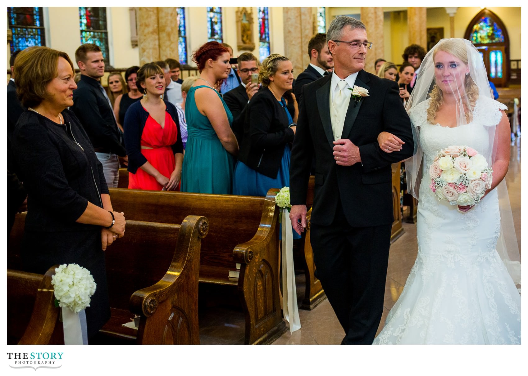 bride walking down aisle at Sacred Heart Basilica wedding ceremony