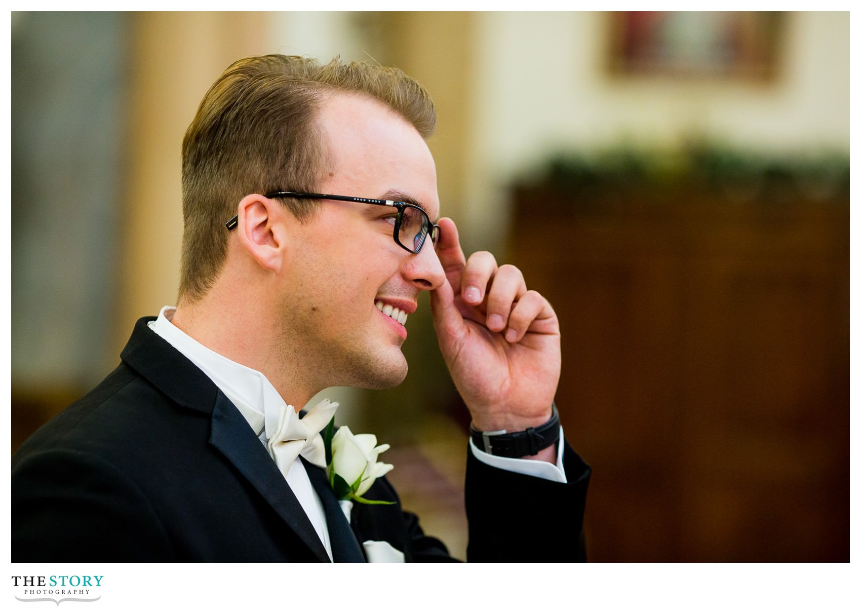 groom watching bride walk down aisle at Syracuse wedding ceremony at Sacred Heart