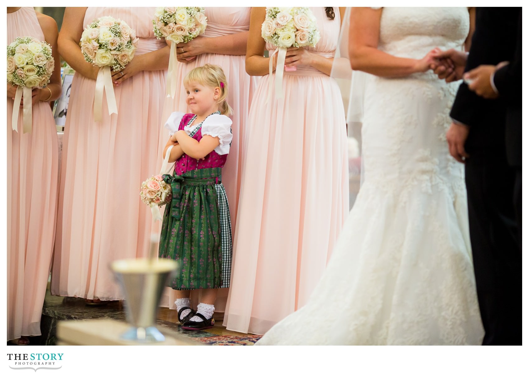 german flower girl during Syracuse wedding ceremony at Sacred Heart