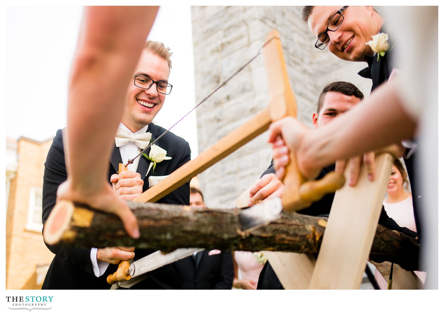 bride and groom cut log in German wedding tradition