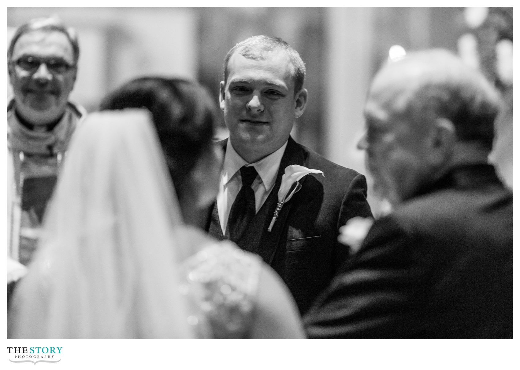 groom looking at bride at Syracuse Cathedral wedding ceremony