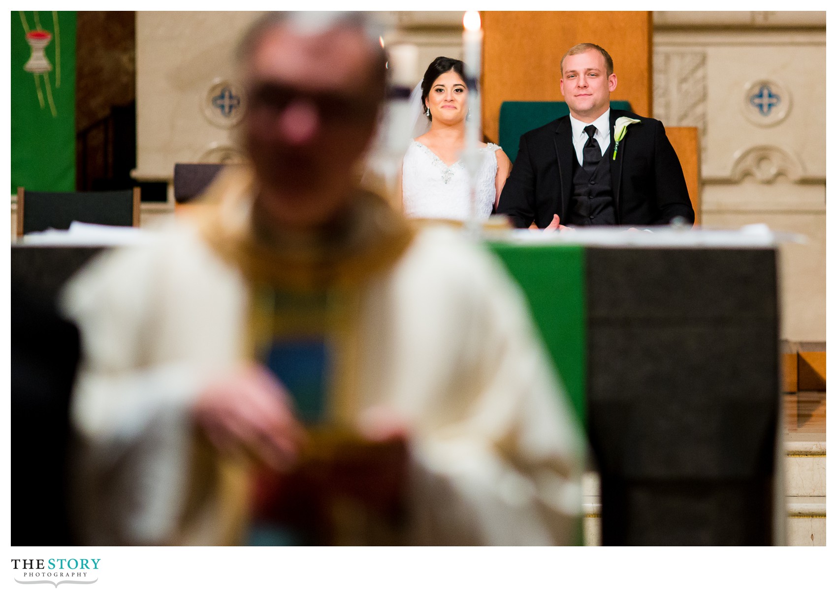 bride and groom relax during wedding ceremony