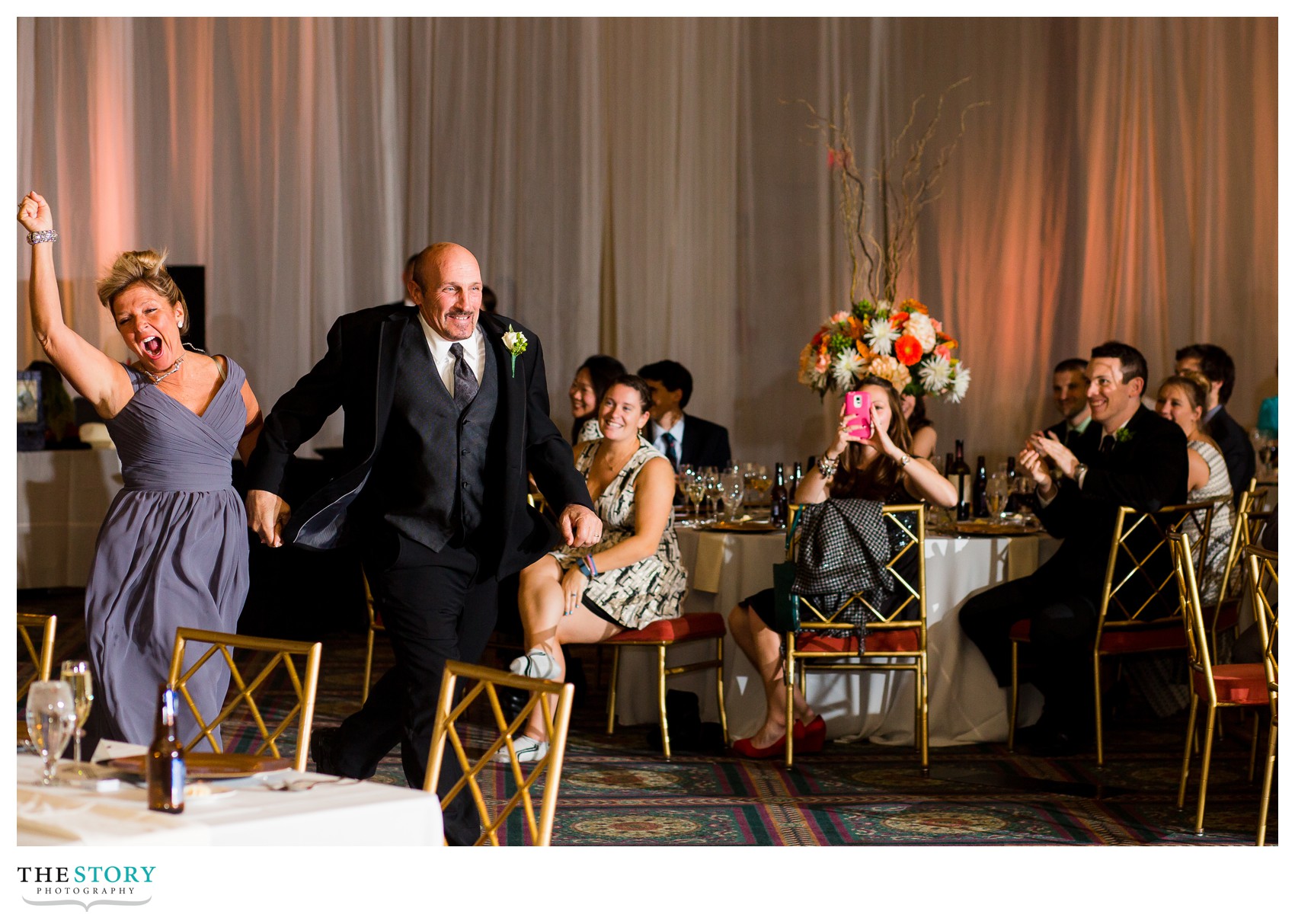 groom's parents entrance at oncenter wedding