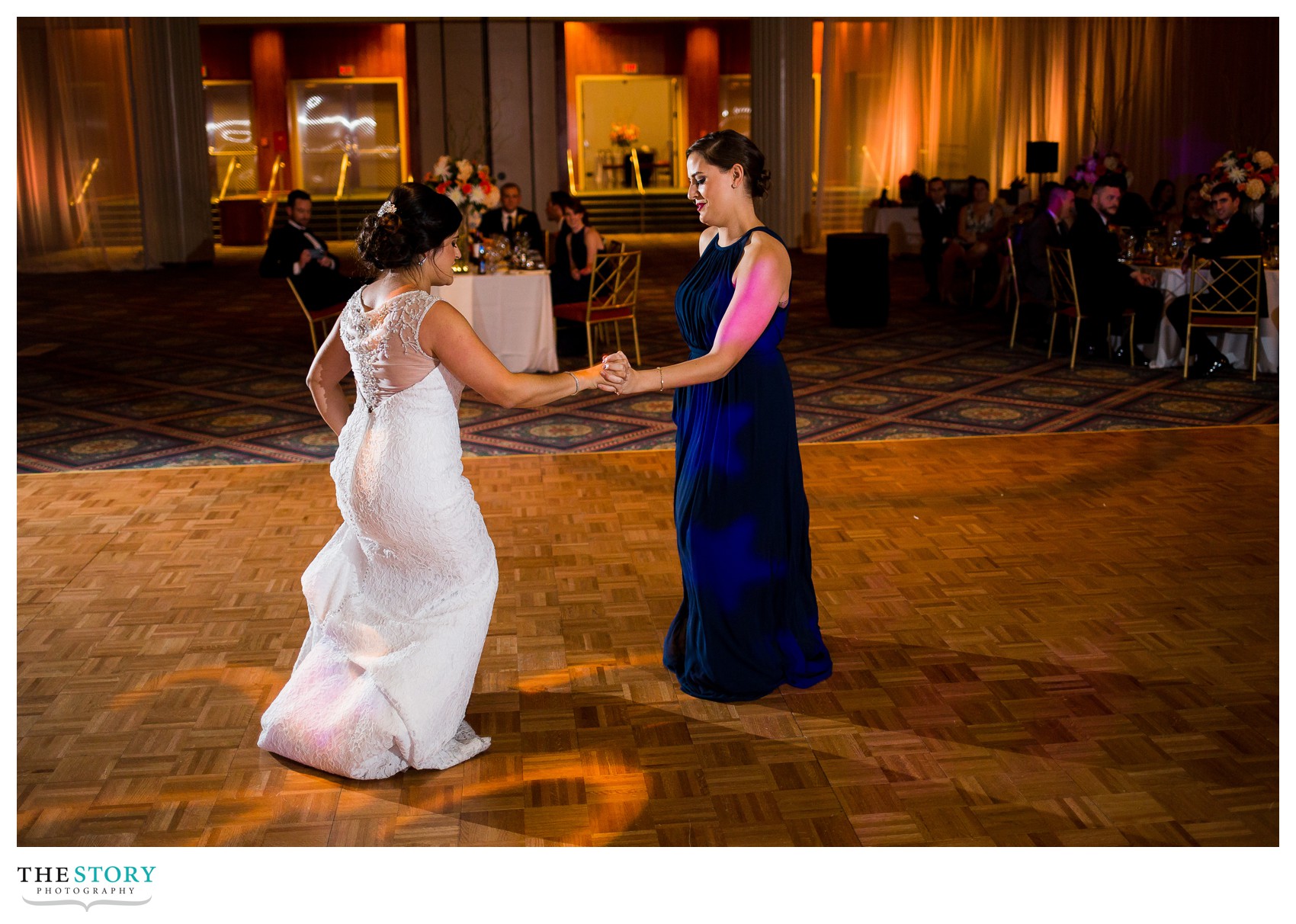 bride and sister have special dance at oncenter wedding reception