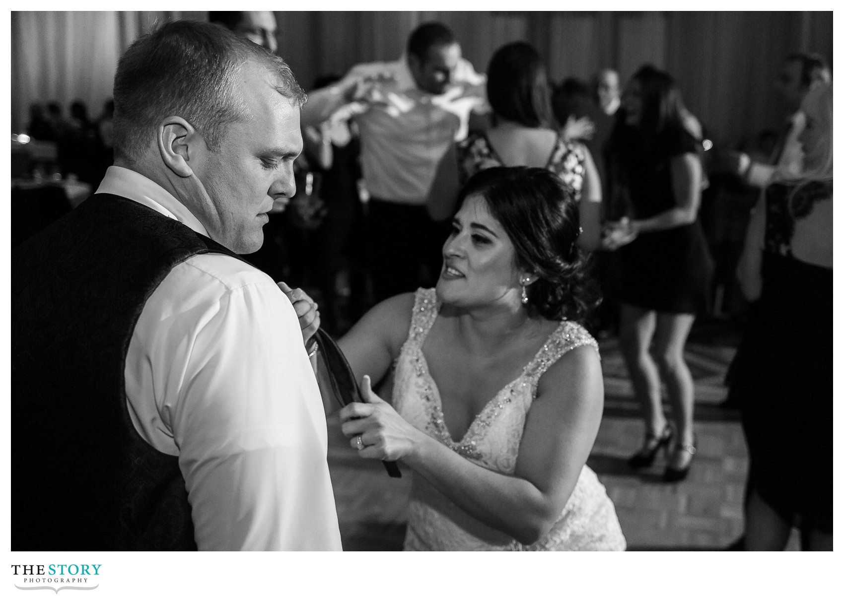 bride and groom have fun at oncenter reception