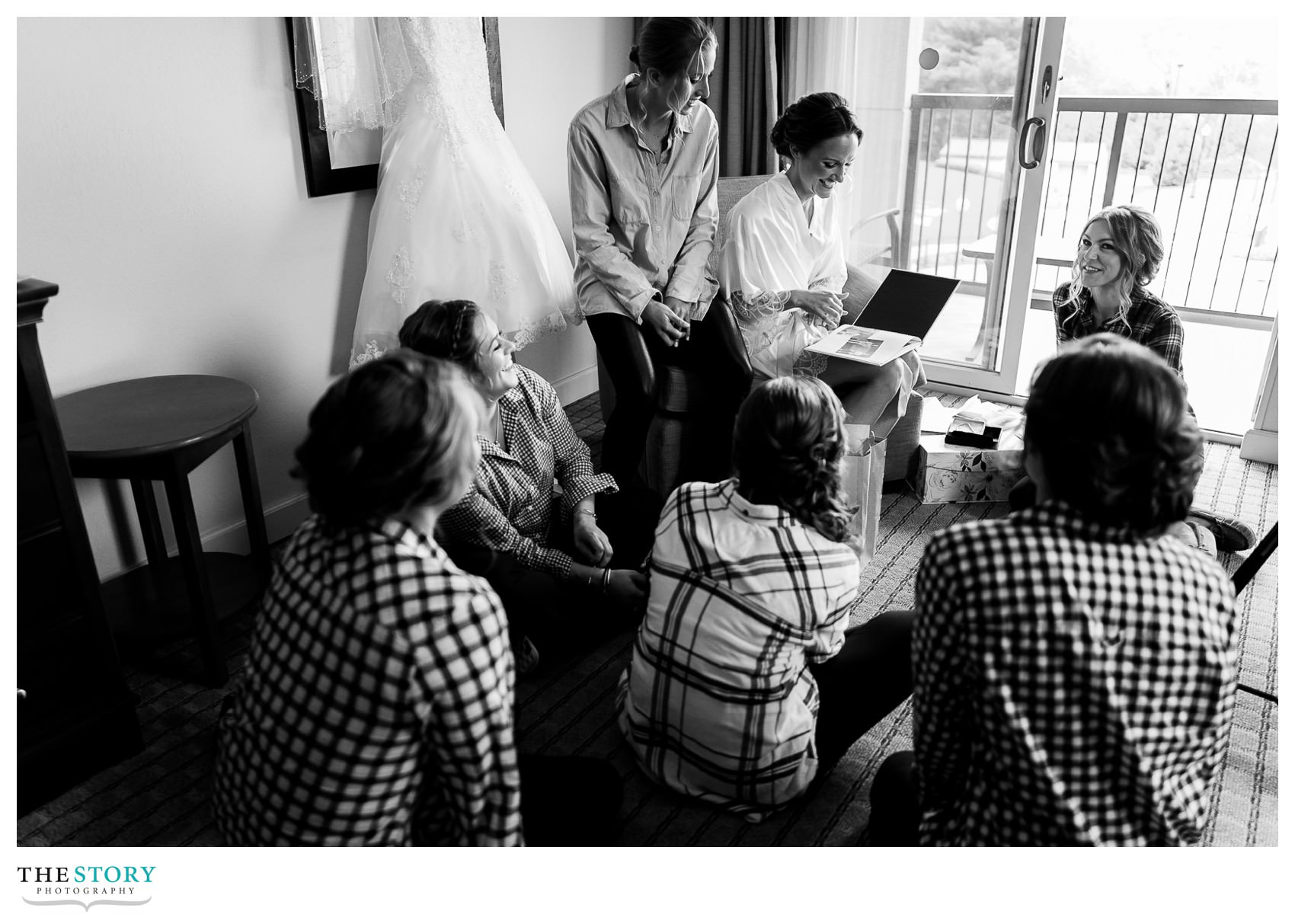 bridesmaids give a gift to the bride