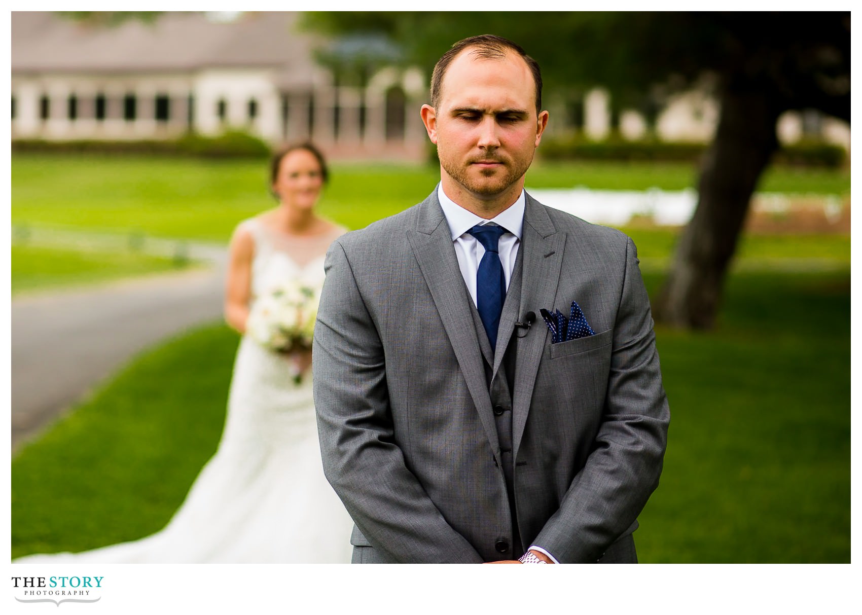 groom waiting to see his bride during the first look at Hiland Park Country Club