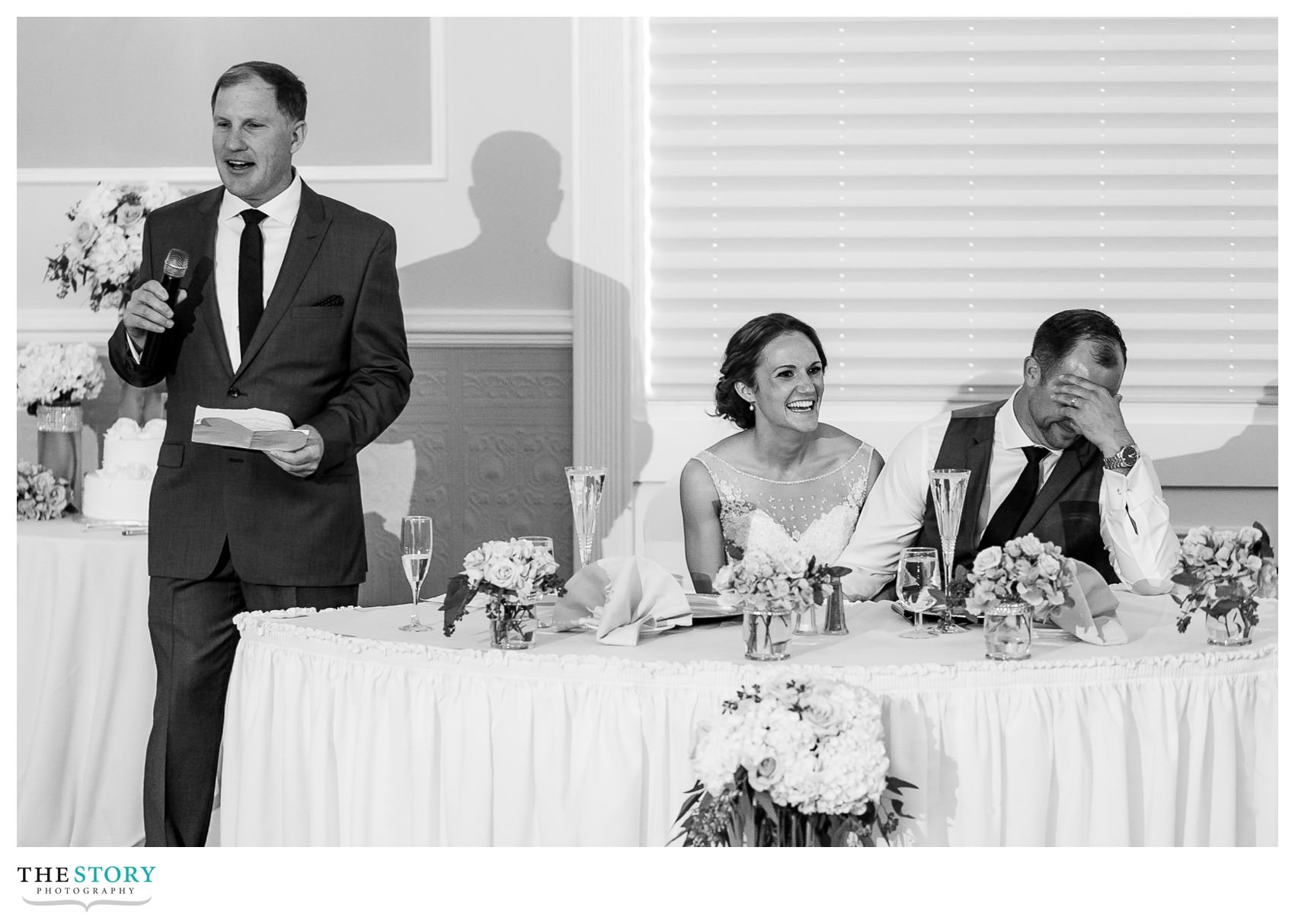 groom reacts to the father of the bride's speech at Hiland Park wedding