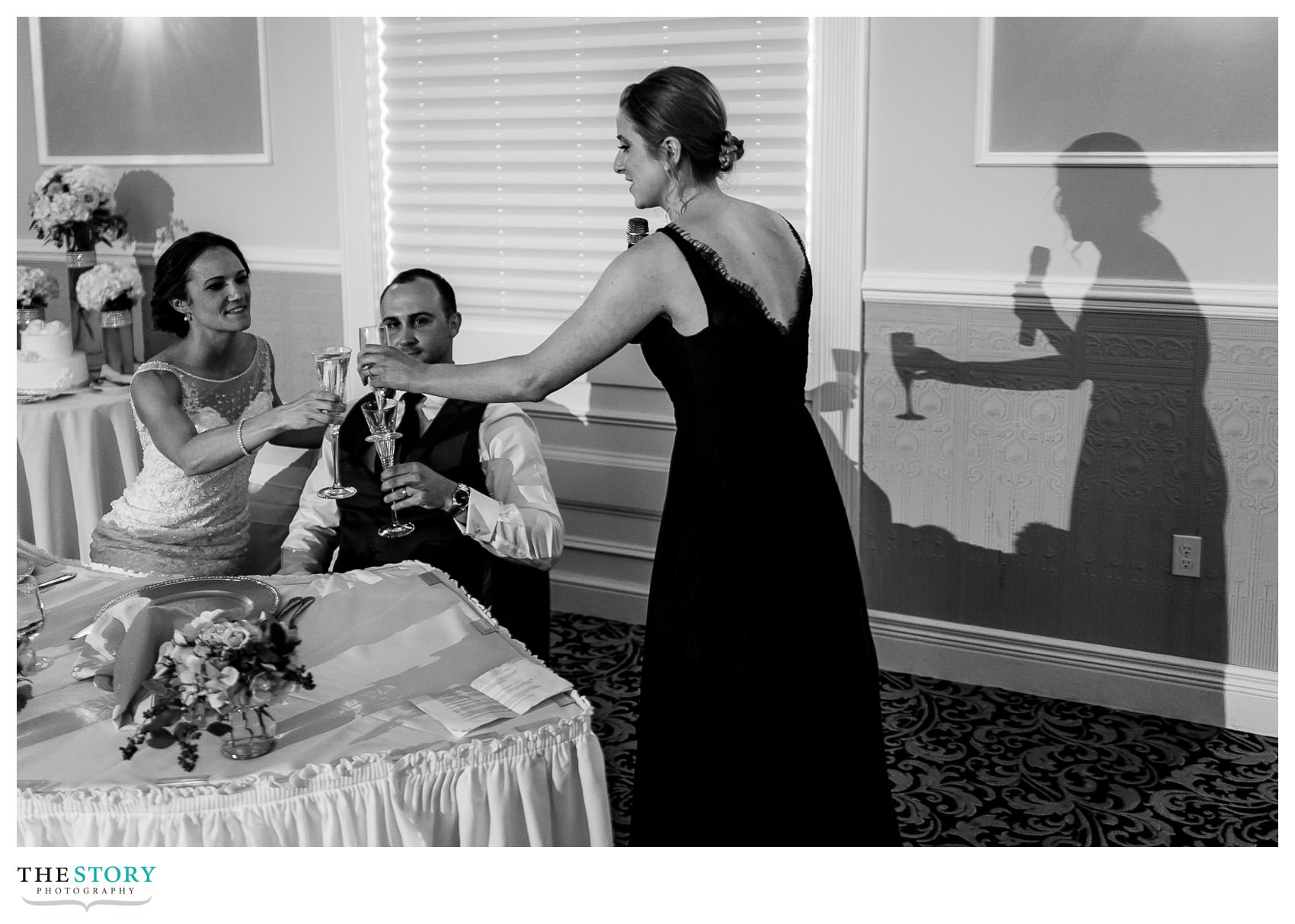maid of honor toasts the bride and groom at Hiland Park Wedding reception