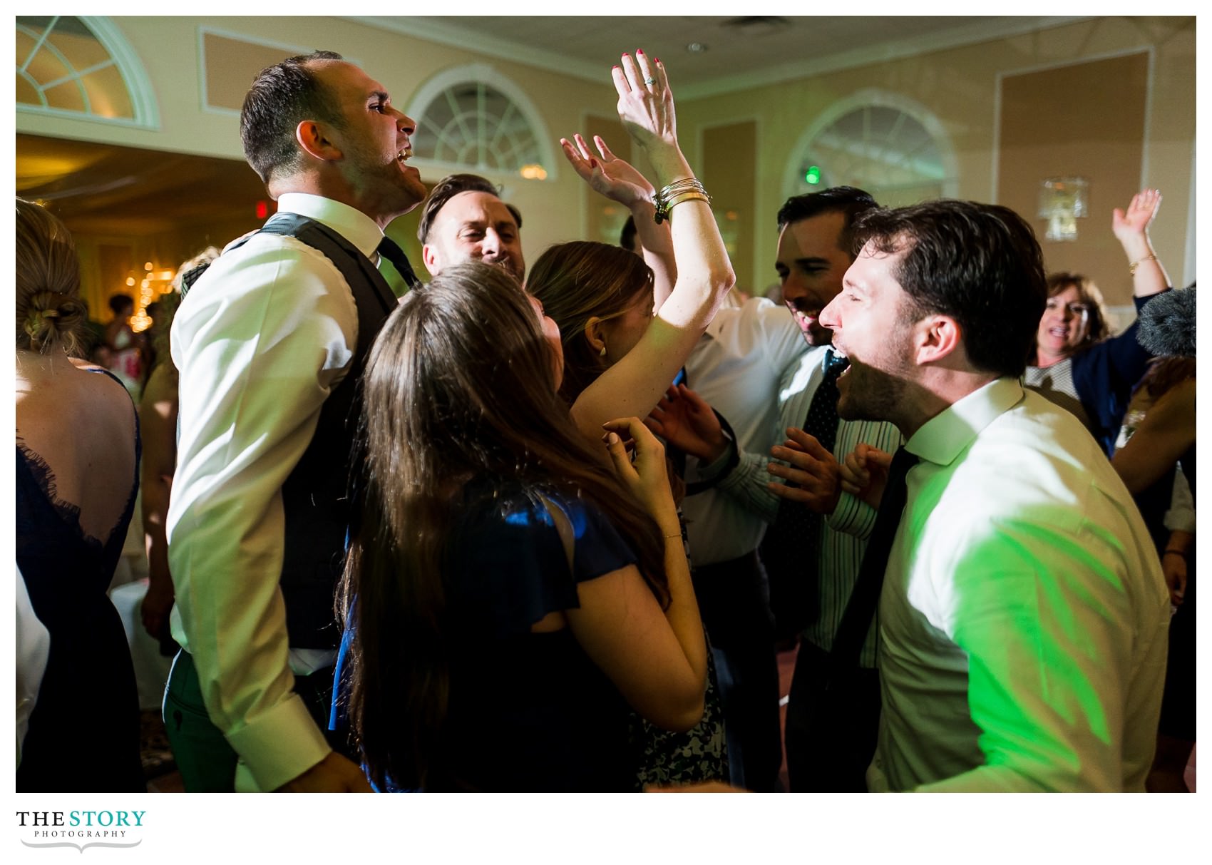 groom partying with friends at Highland Park wedding reception