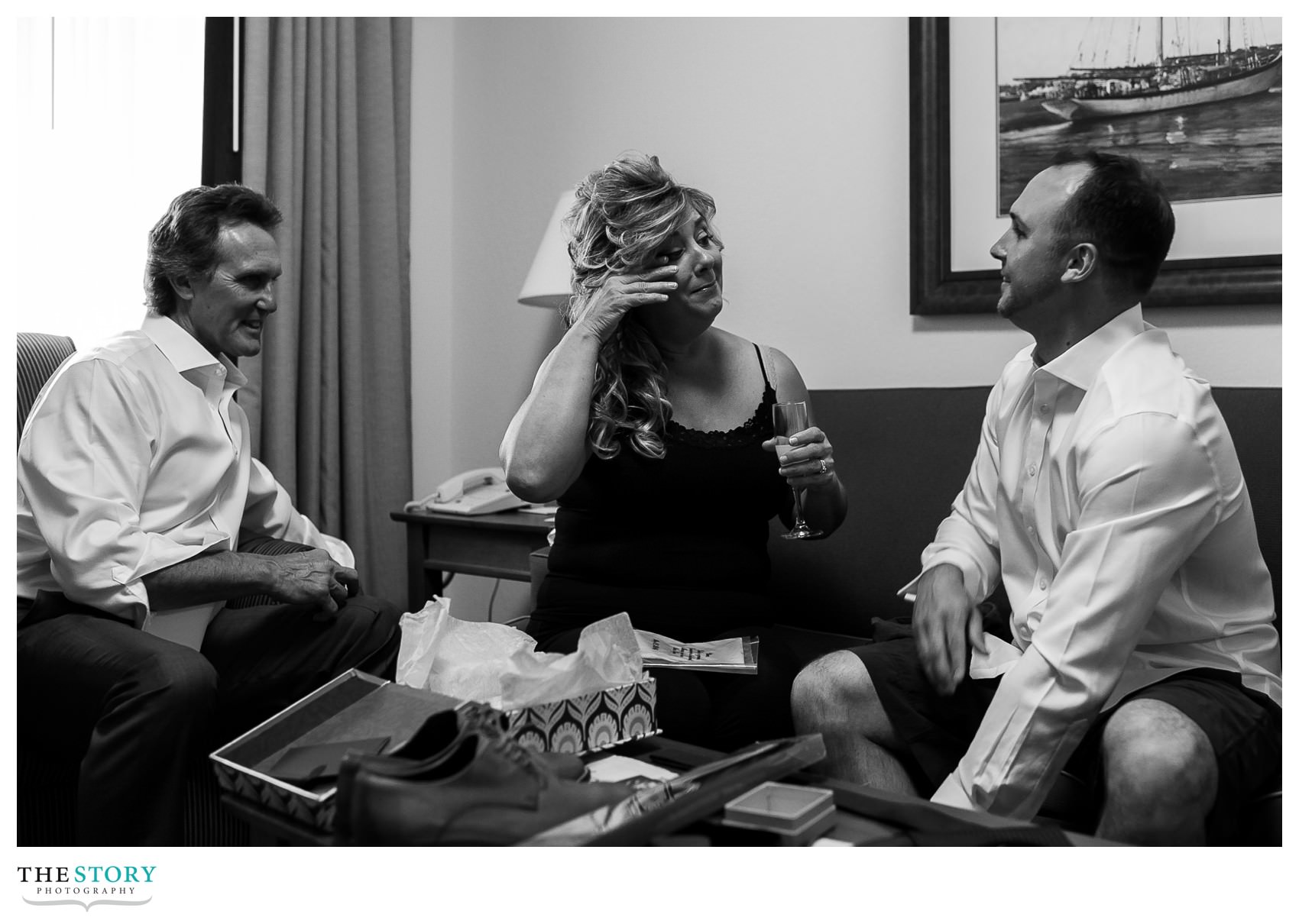groom shares gifts with his parents on the wedding day in Lake George