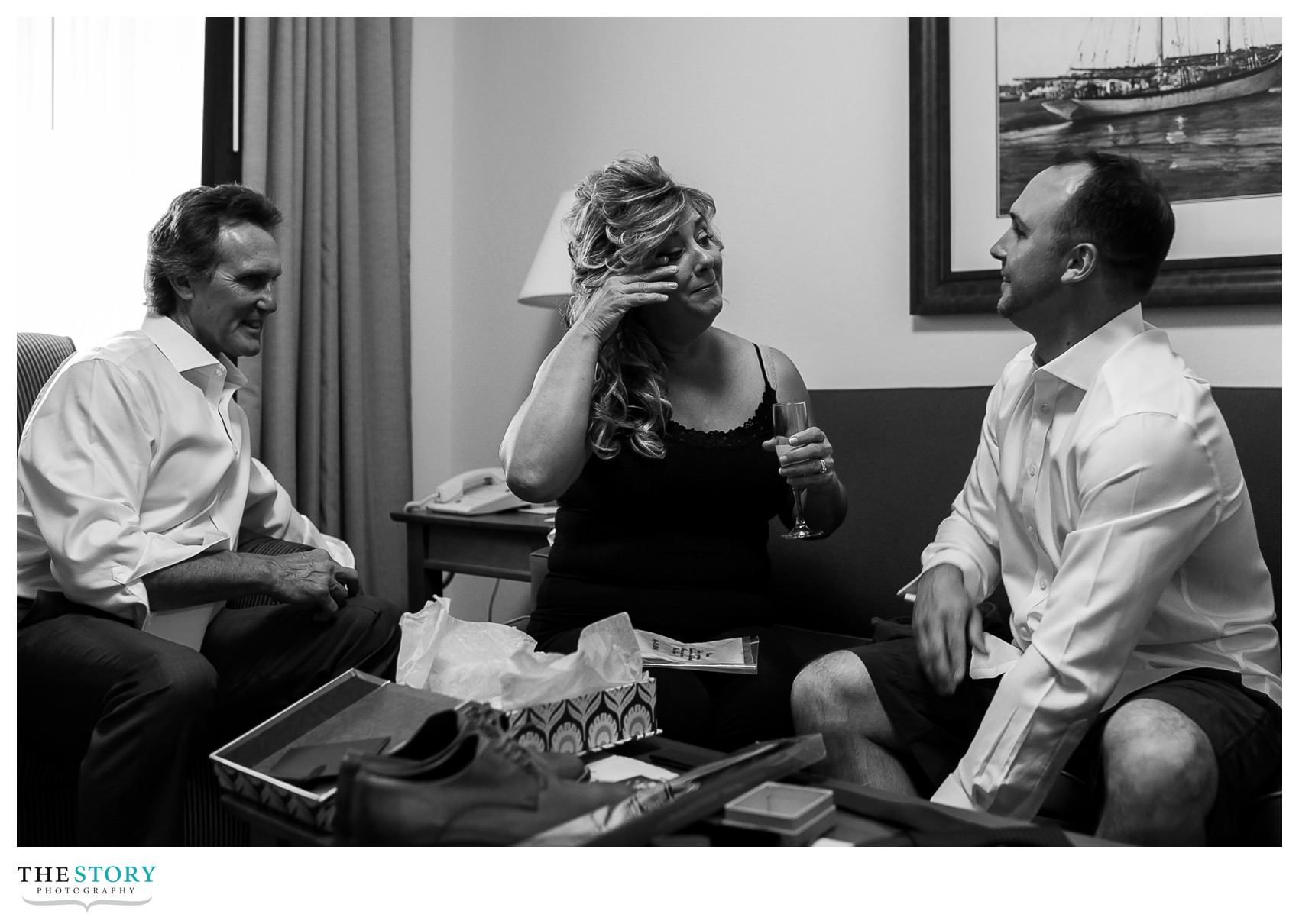 groom shares gifts with his parents on the wedding day in Lake George