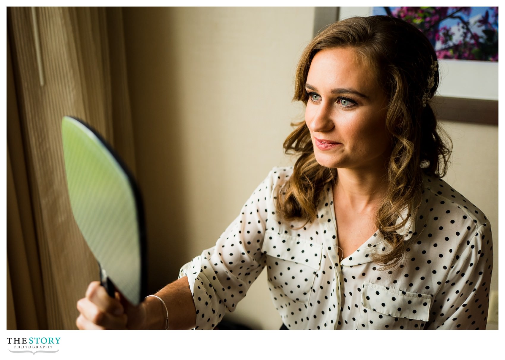 bride checks out her makeup at Cornell's Statler Hotel