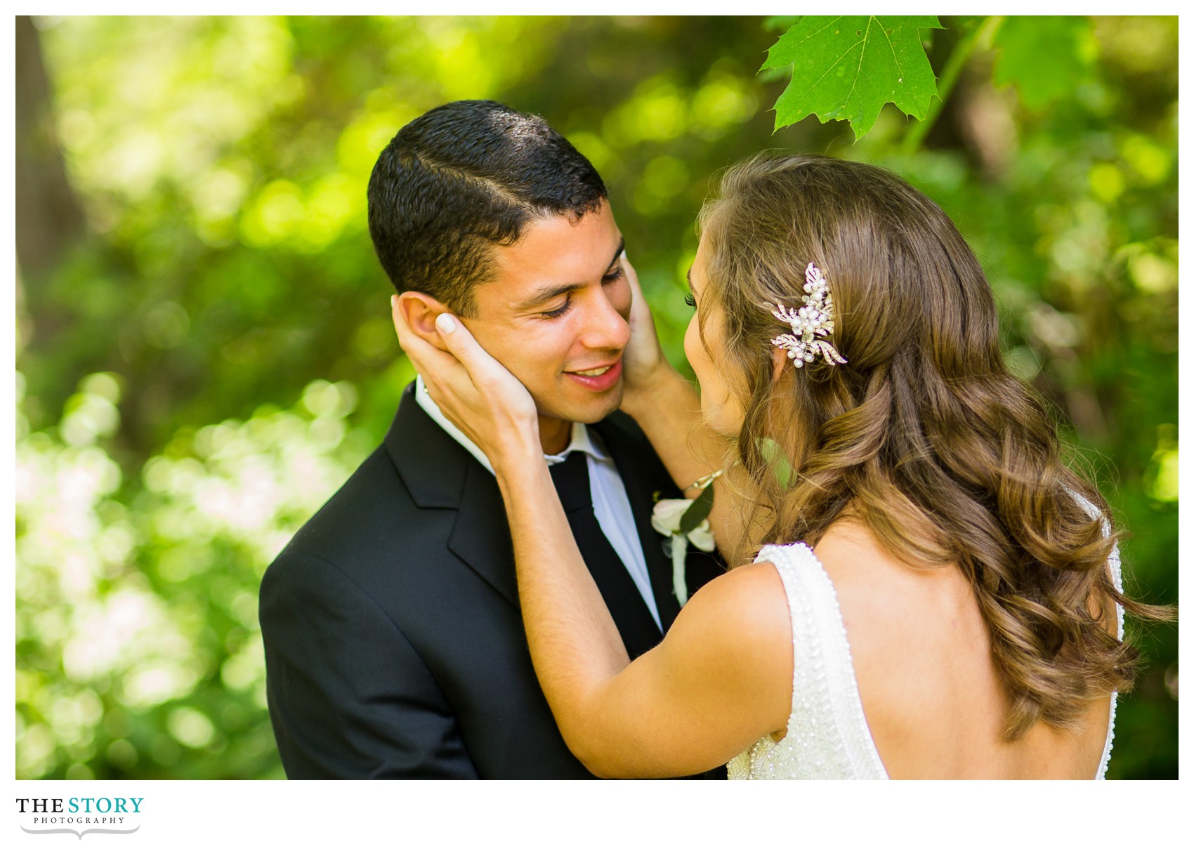 bride and groom enjoy a moment during their first look at Cornell University