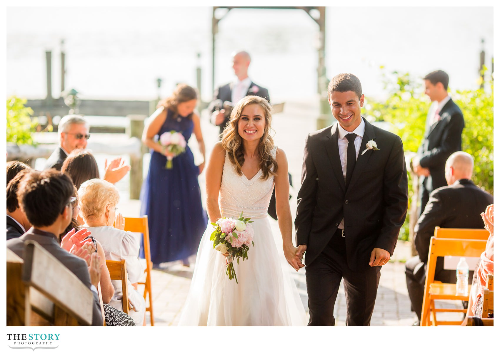 bride and groom walk aisle at Ithaca Farmers market wedding ceremony