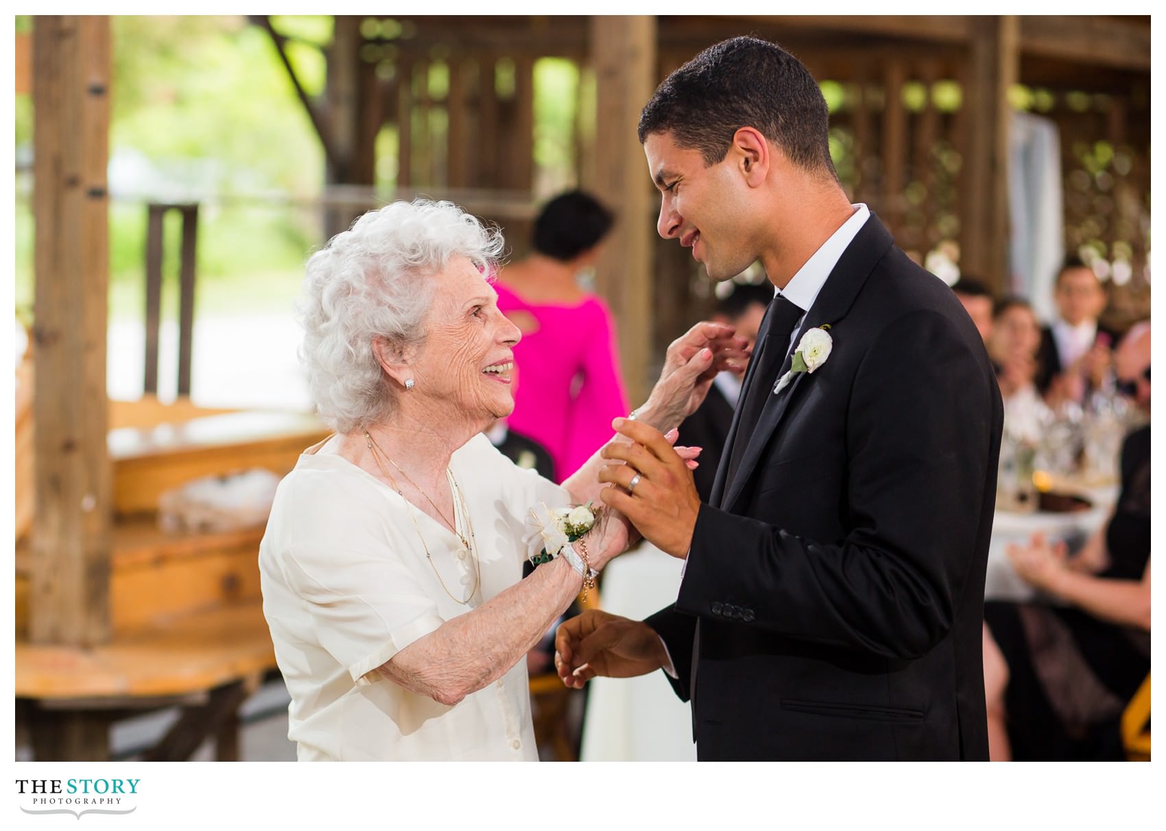 groom dances with grandmother at Ithaca wedding at the Farmers Market