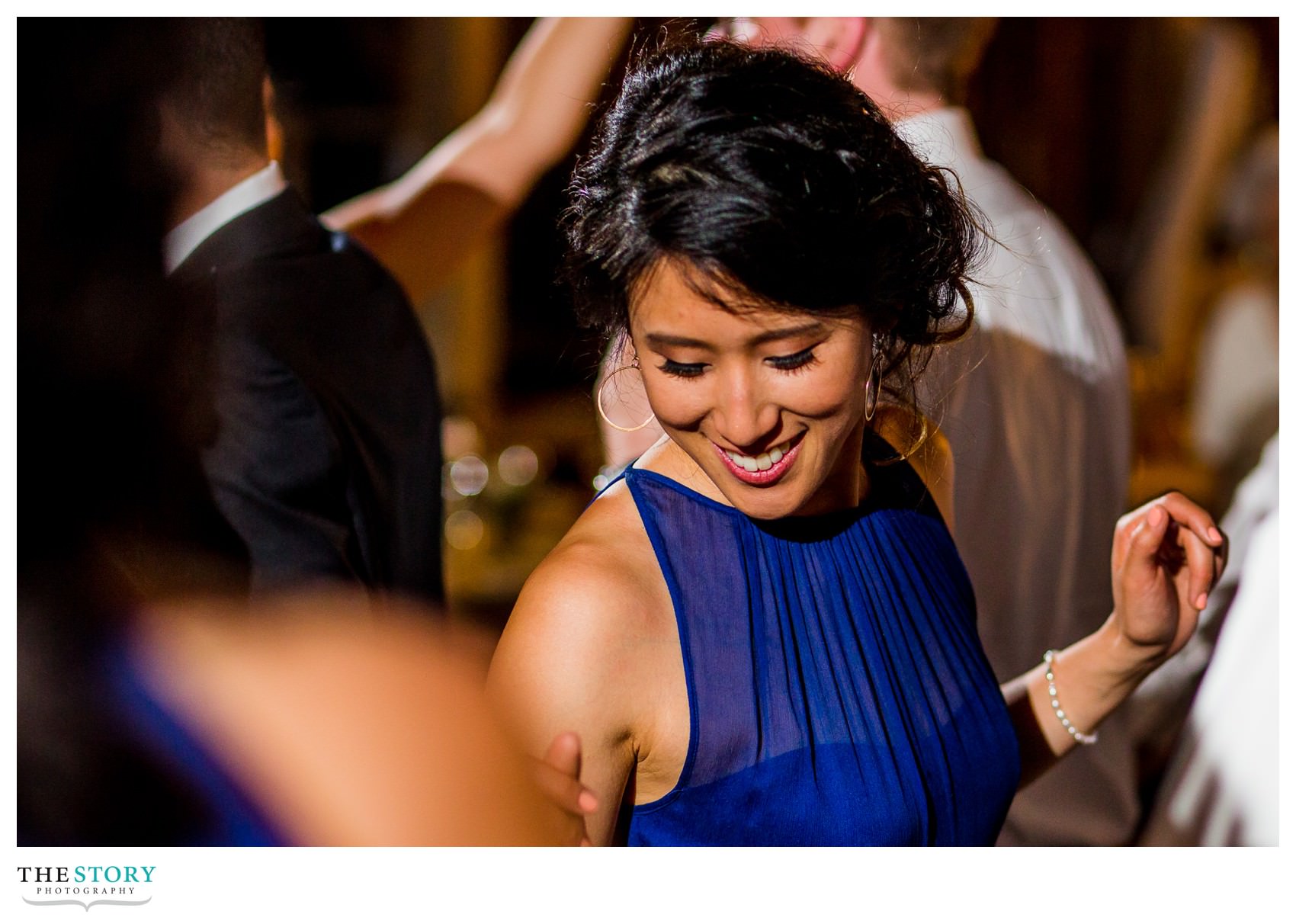 bridesmaid dancing at wedding reception in Ithaca