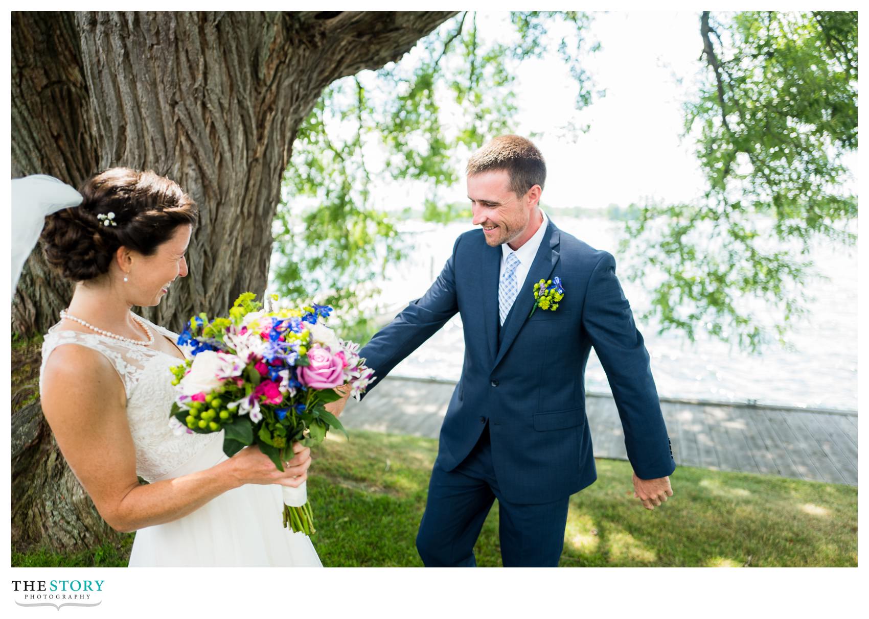 groom sees bride for first time on wedding day in Clayton, NY