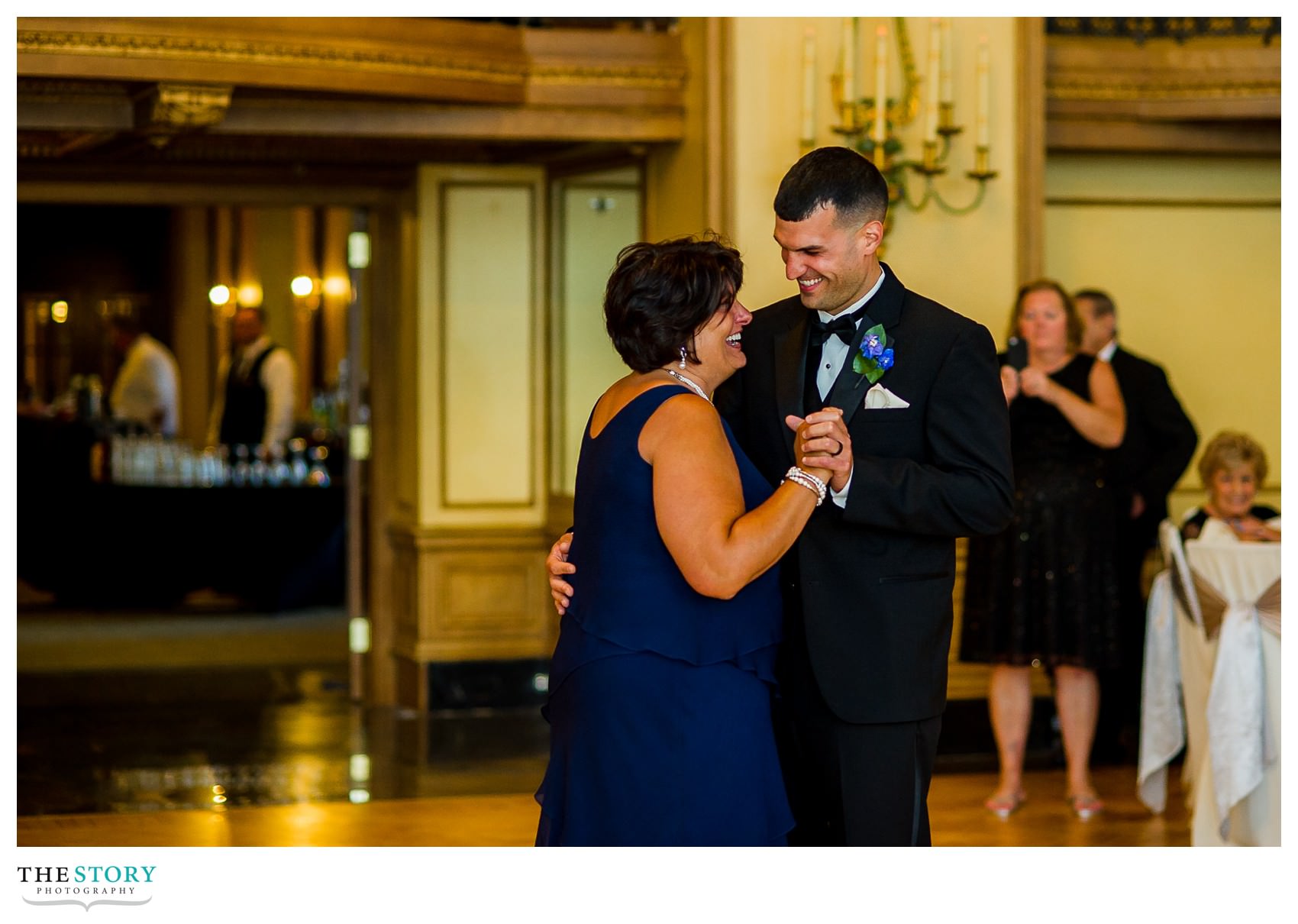 
mother dances with goom at Marriott Syracuse Downtown wedding reception