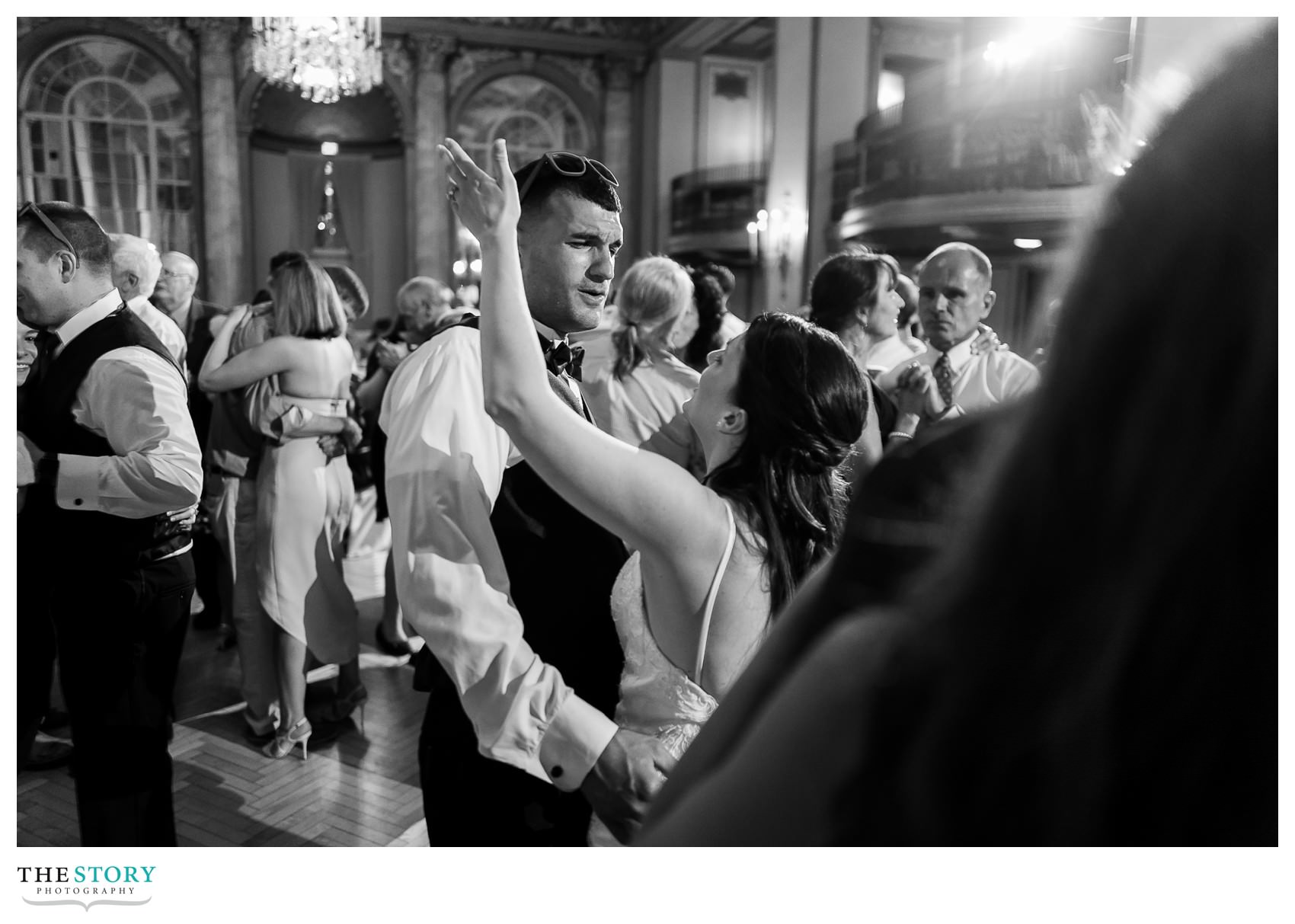 bride and groom dance at Marriott Syracuse Downtown ballroom reception