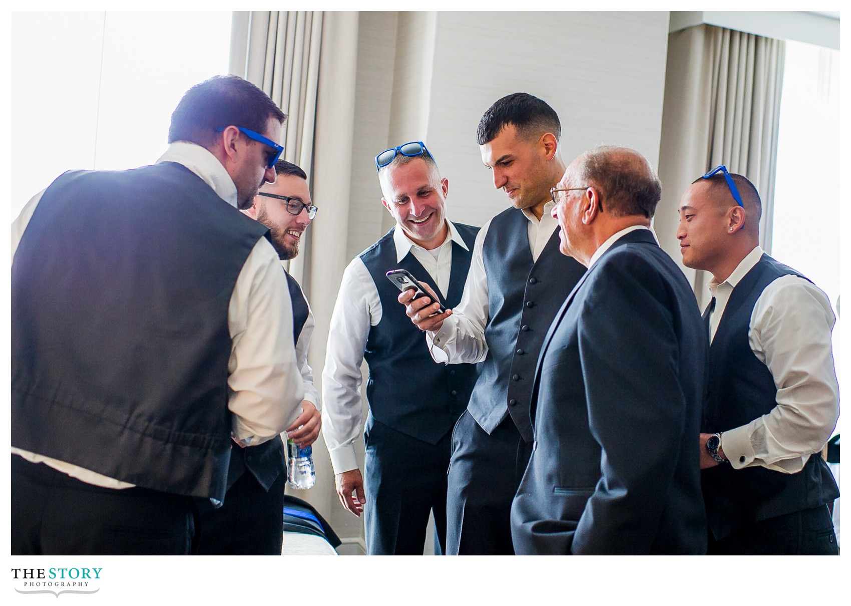 groom getting ready with guys at Marriott Syracuse Downtown