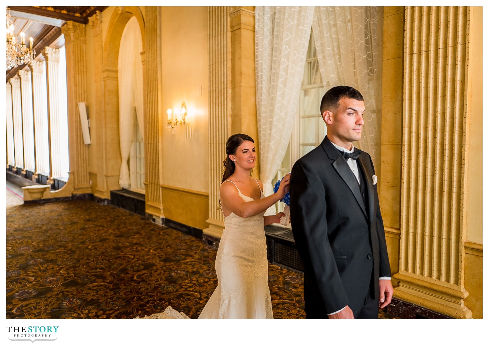 wedding day first look on Persian Terrace of Marriott Syracuse Downtown