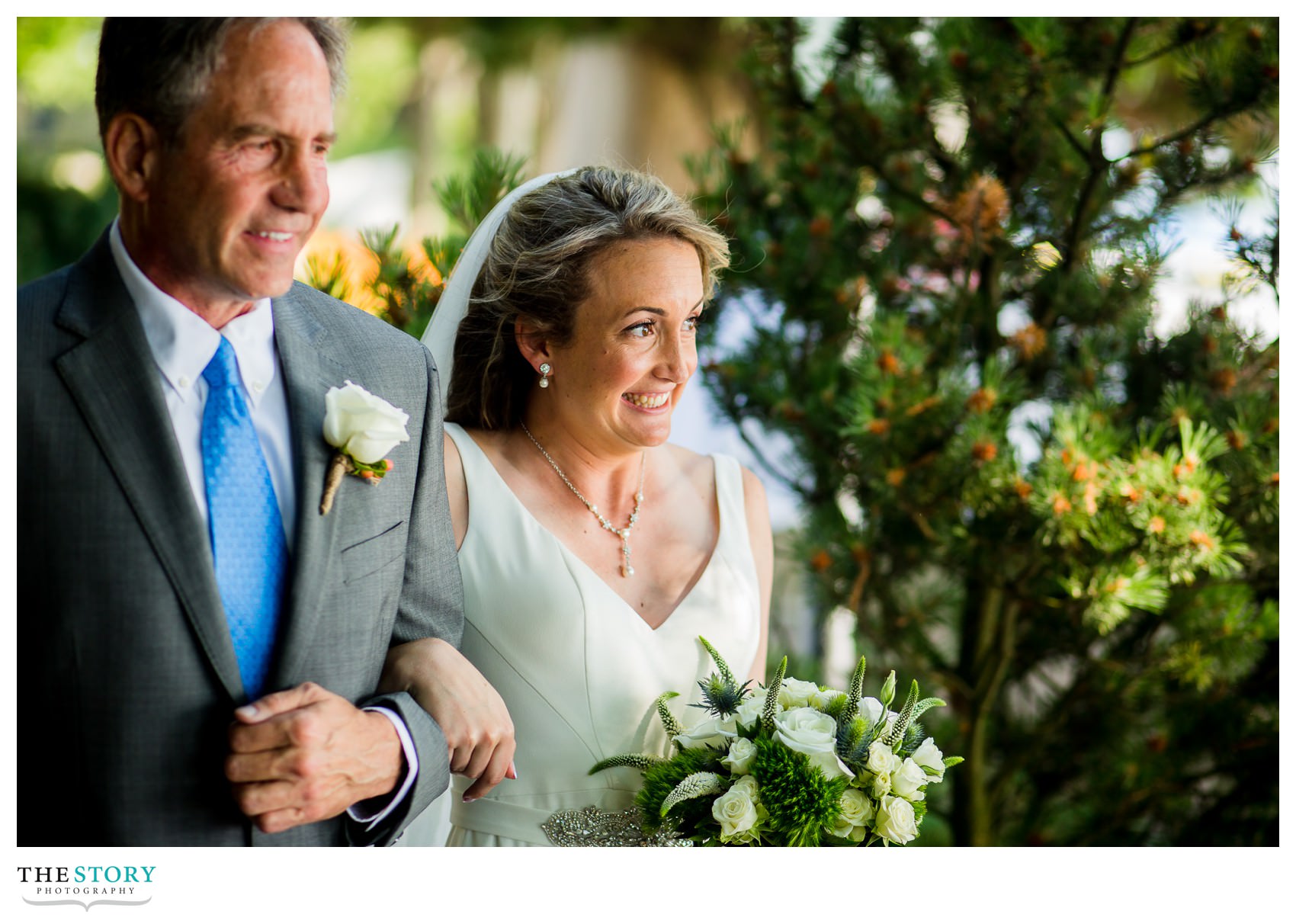 bride walks down aisle with her father at outdoor wedding ceremony in Skaneateles