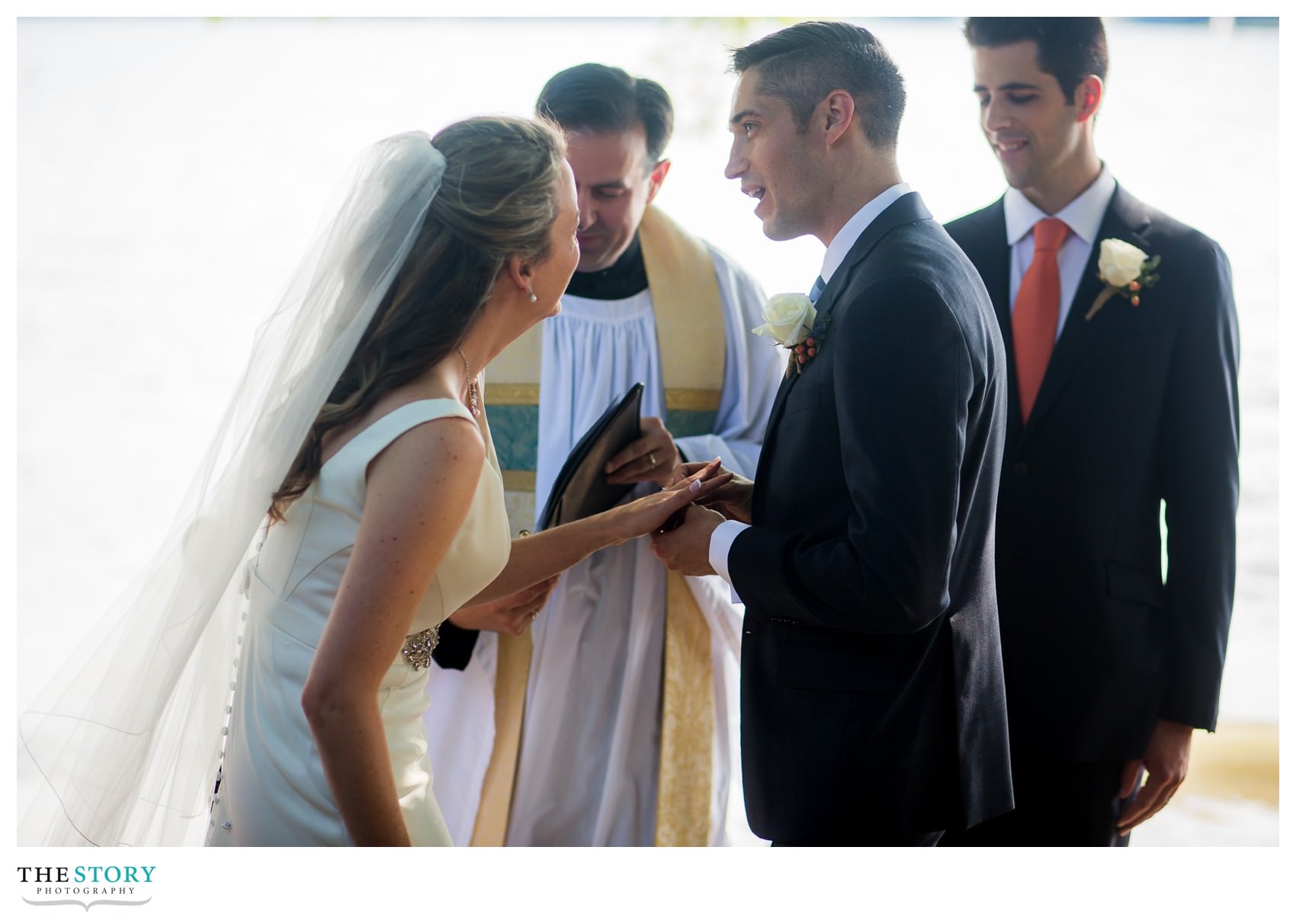 bride and groom laughing during ring exchange