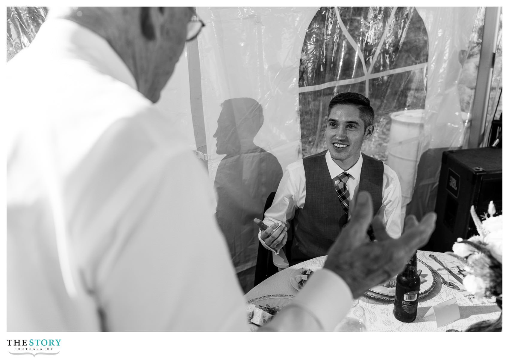 groom enjoys a moment with his grandfather at Skaneateles wedding