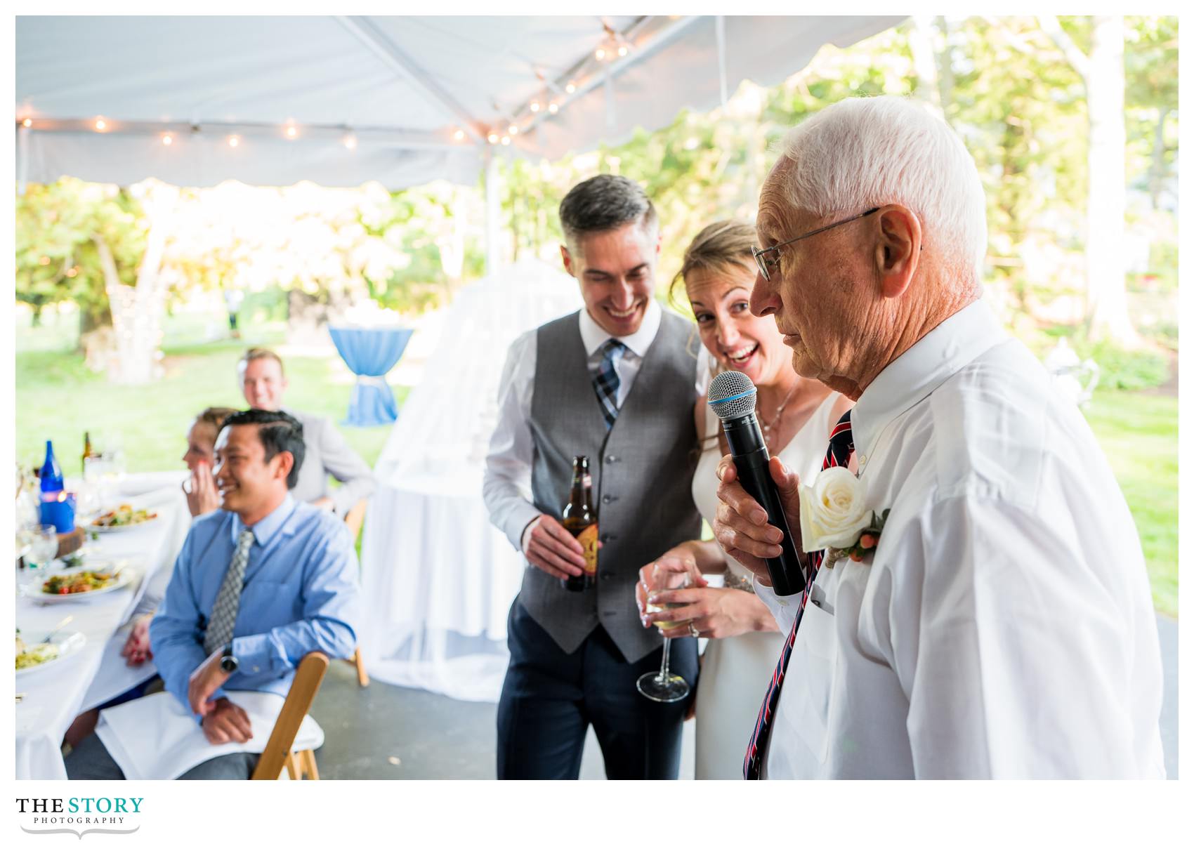 grandfather of groom speaks at Skaneateles private residence wedding