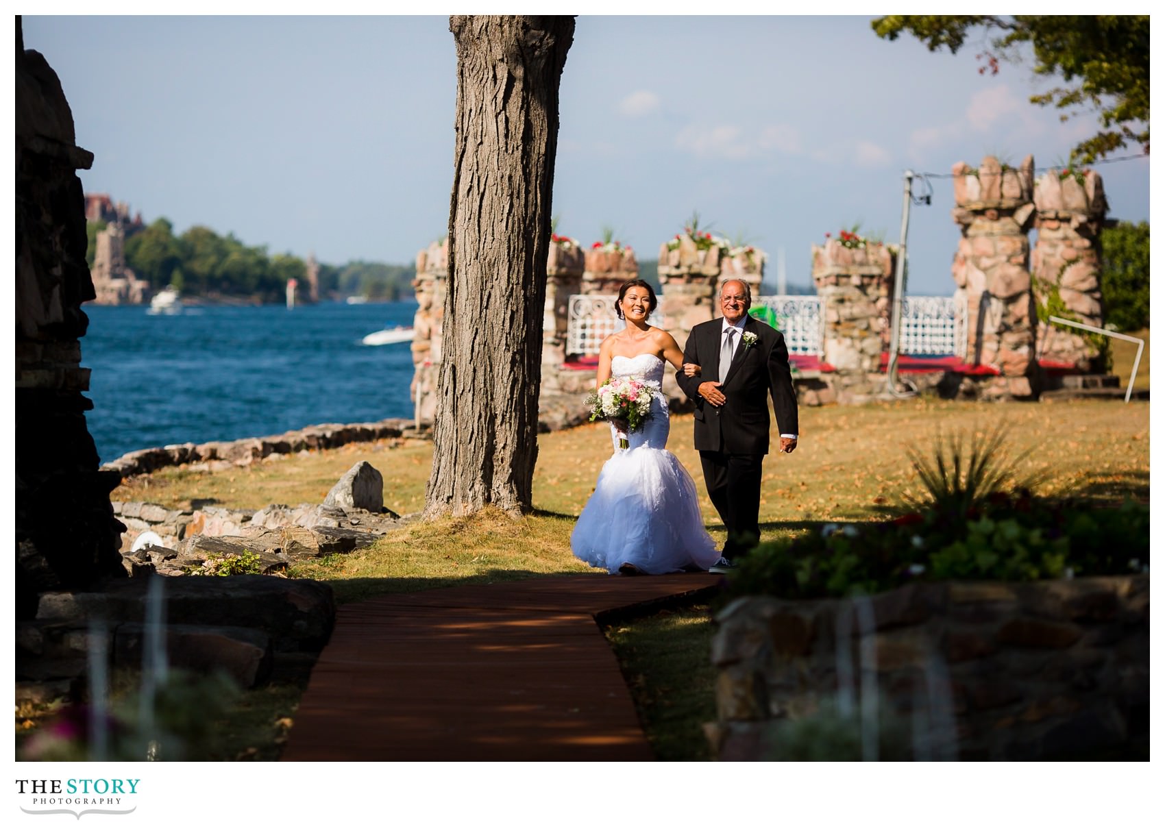 bride walks with father to wedding ceremony on Cherry Island