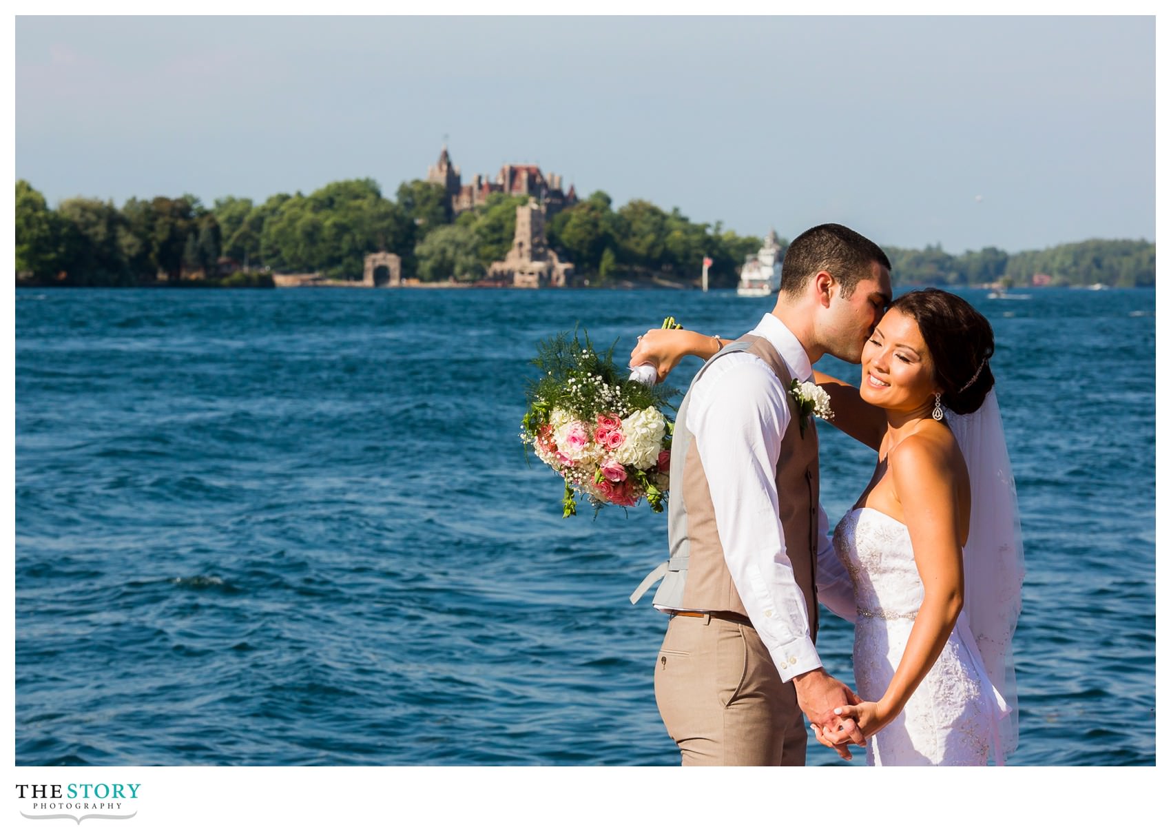 wedding day portrait with Boldt Castle in the background