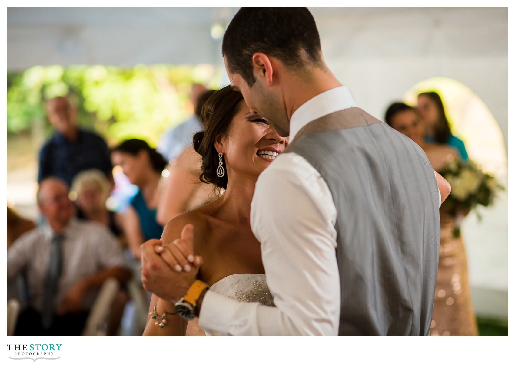 bride and groom enjoy first dance at outdoor thousand islands wedding