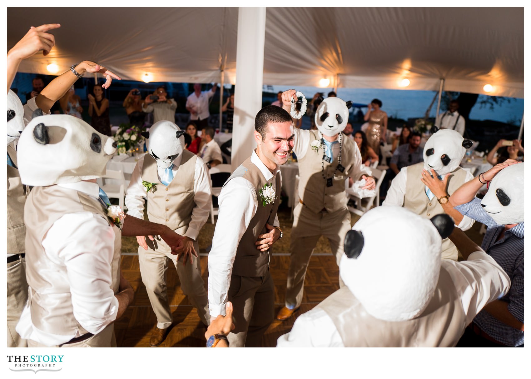 groomsmen surprise the groom with panda masks
