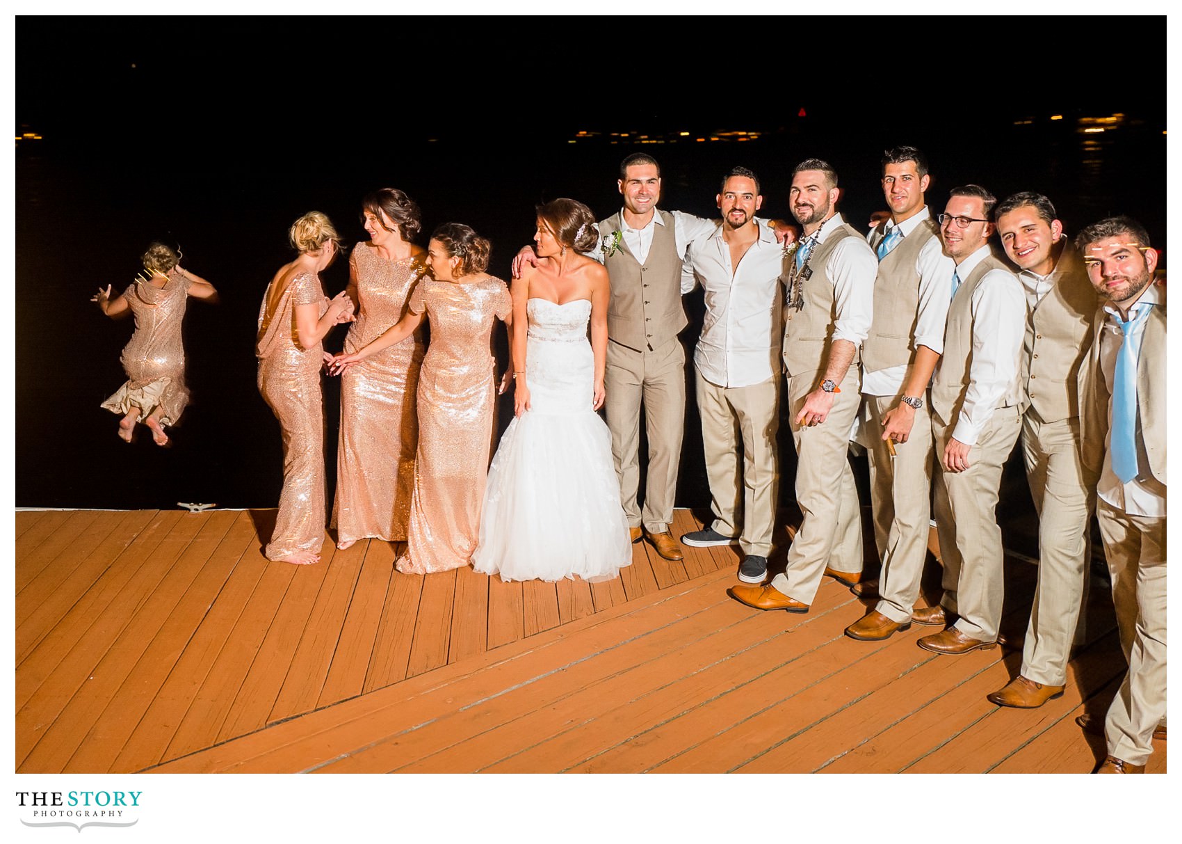 bridesmaid jumps in the river at the end of the wedding day