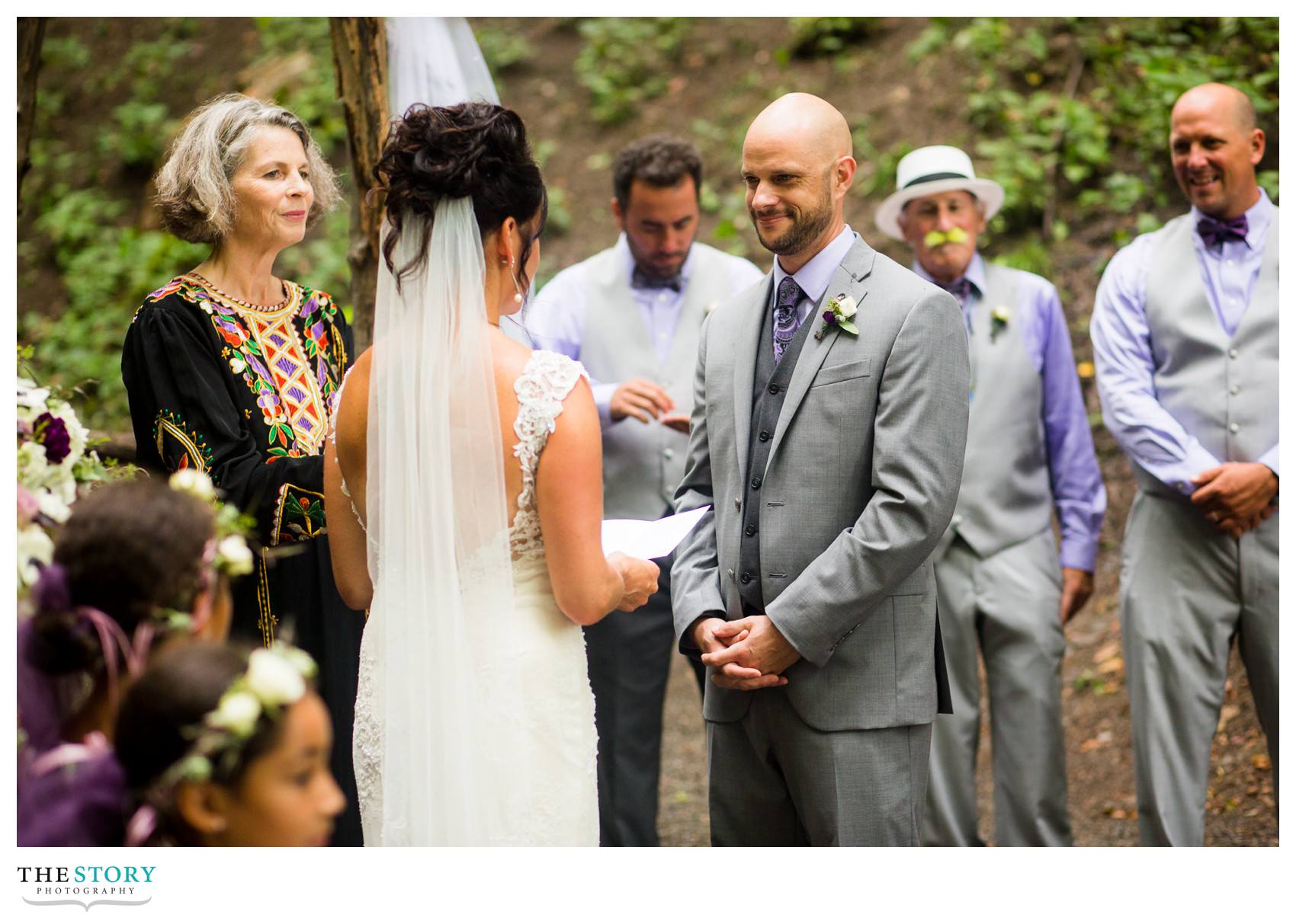 bride and groom exchange vows at Ithaca wedding