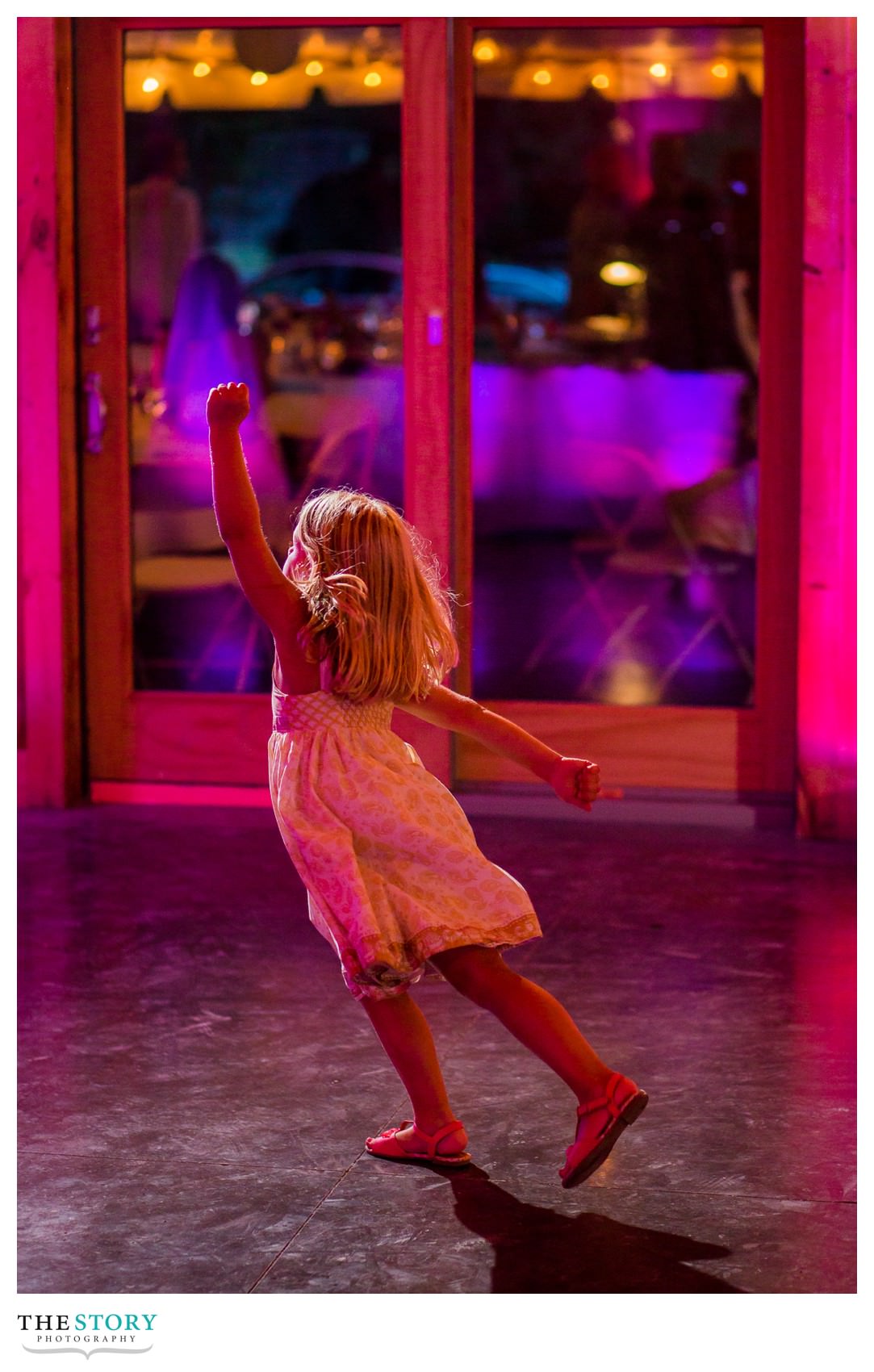 little girl dancing before wedding reception at New Park