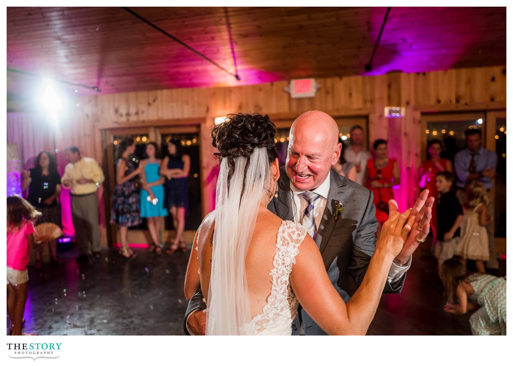 bride dances with father at wedding reception