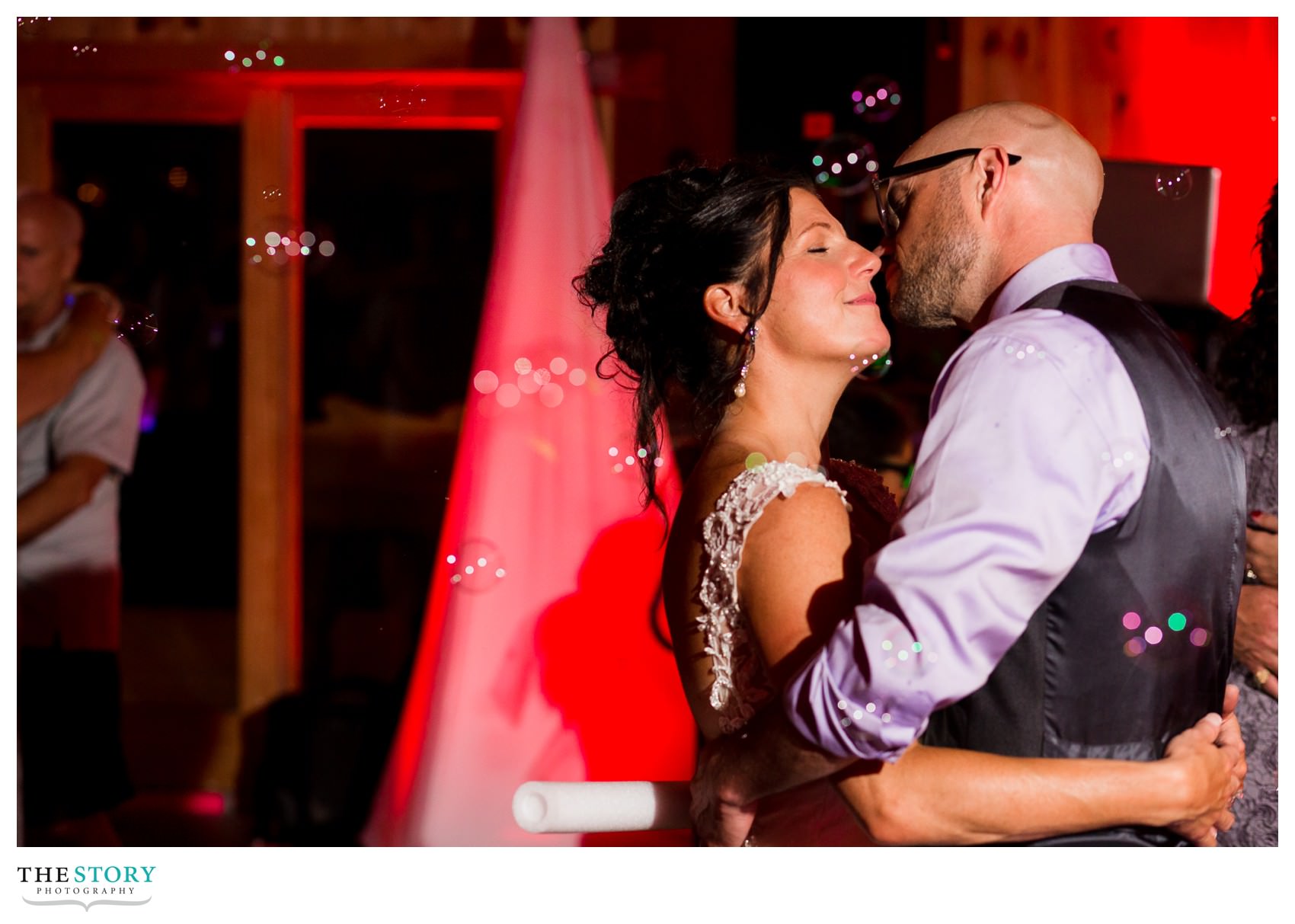 bride and groom enjoy a moment during the wedding reception at New Park