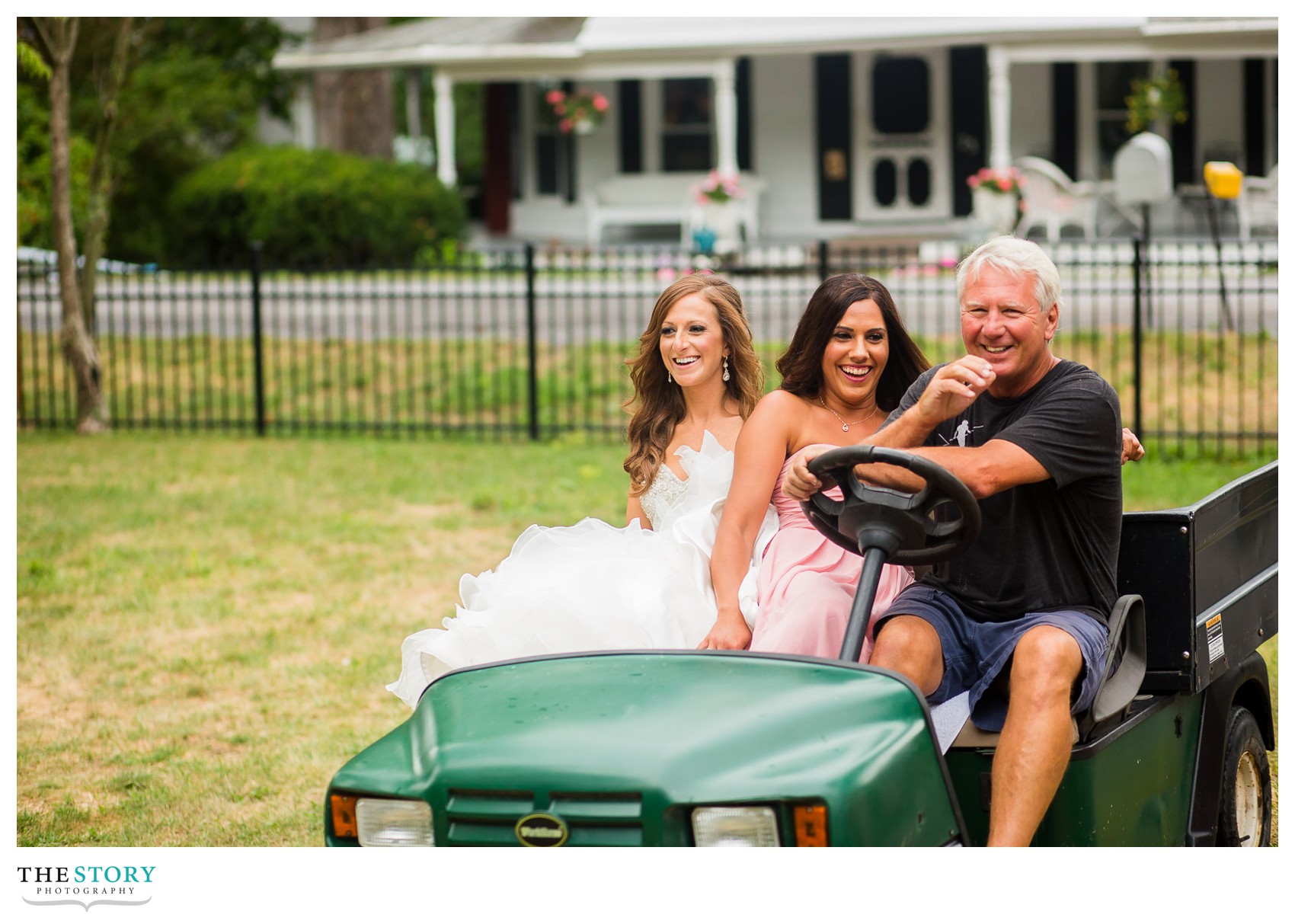 bride and bridesmaid ride in golf cart at Glenora Falls