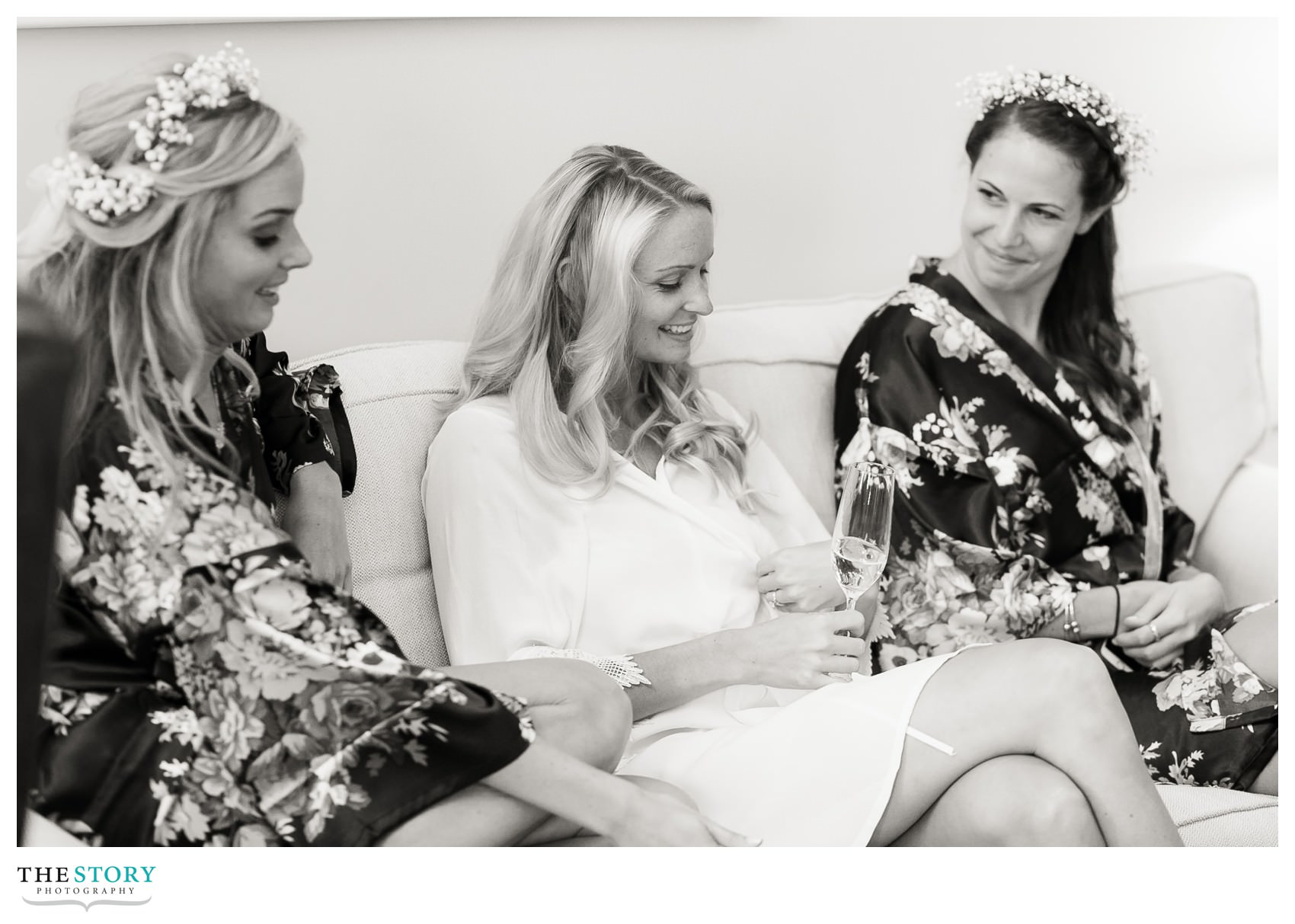 bride and bridesmaids enjoy a moment before the Cape Cod wedding