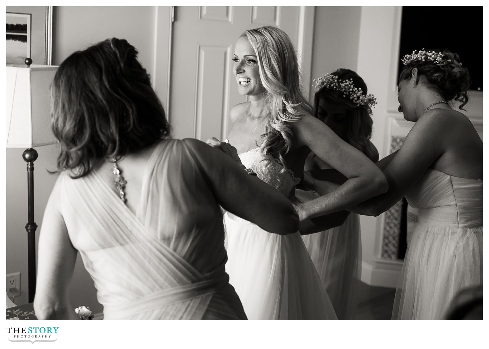 Bride getting dress on at Chatham Bars Inn