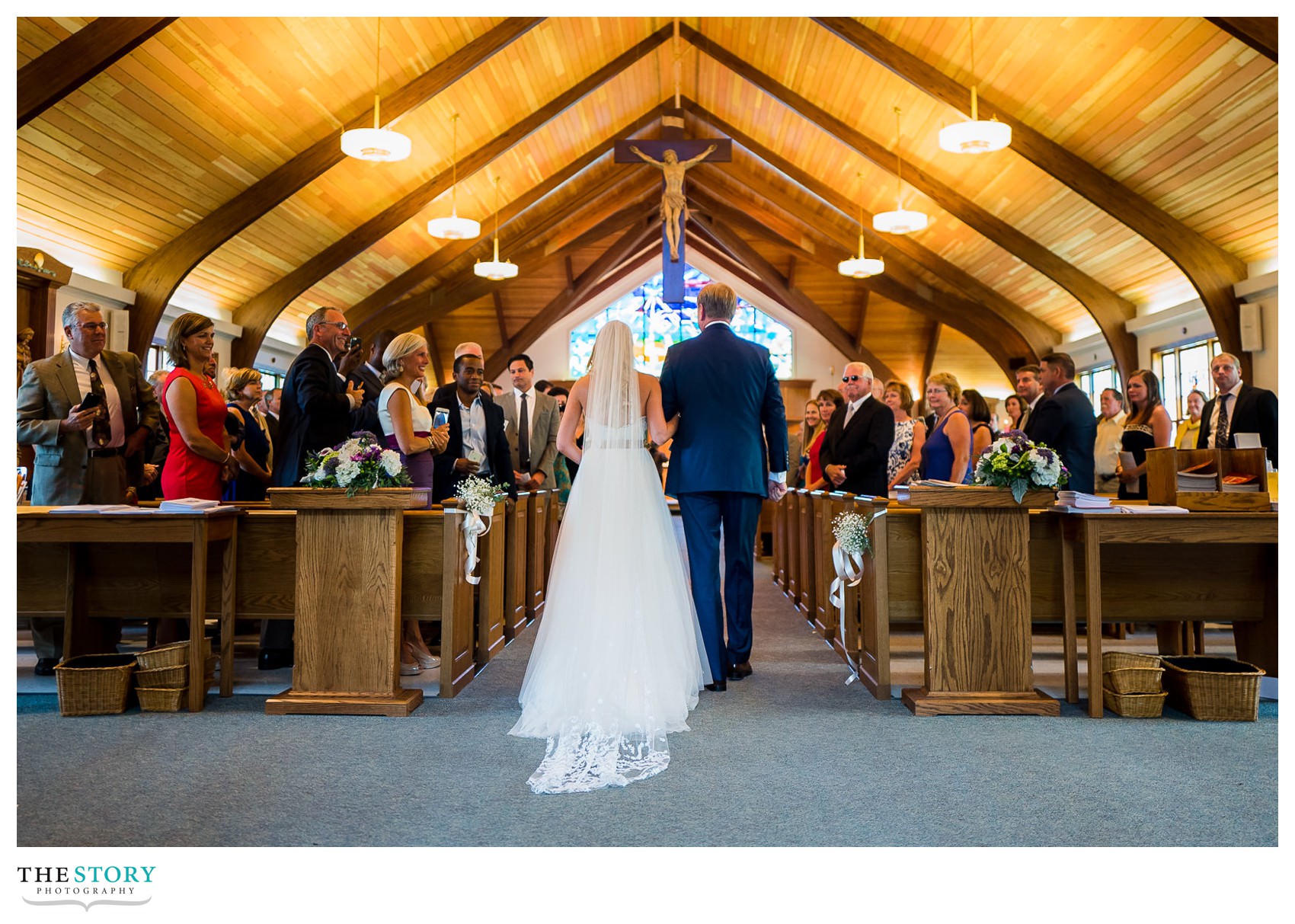 Bride walks down the aisle at Our Lady of the Cape church