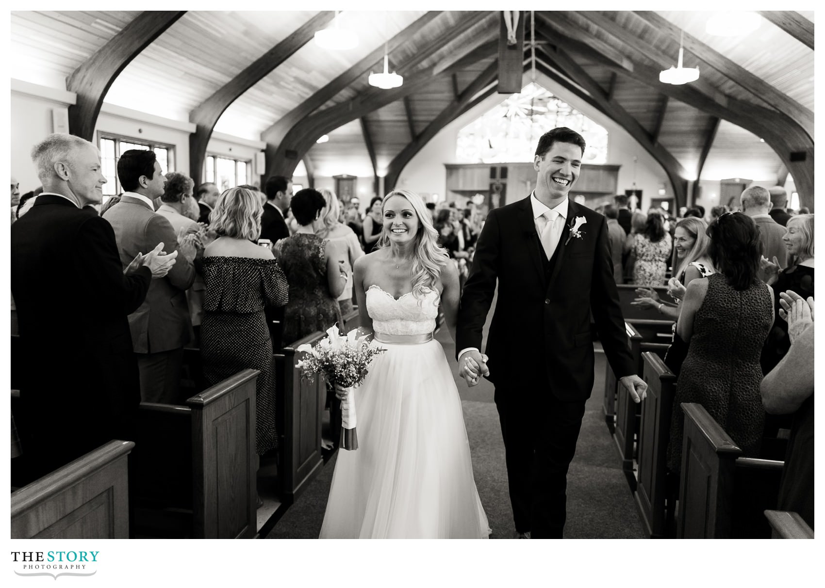 bride and groom exit wedding ceremony at Our Lady of The Cape