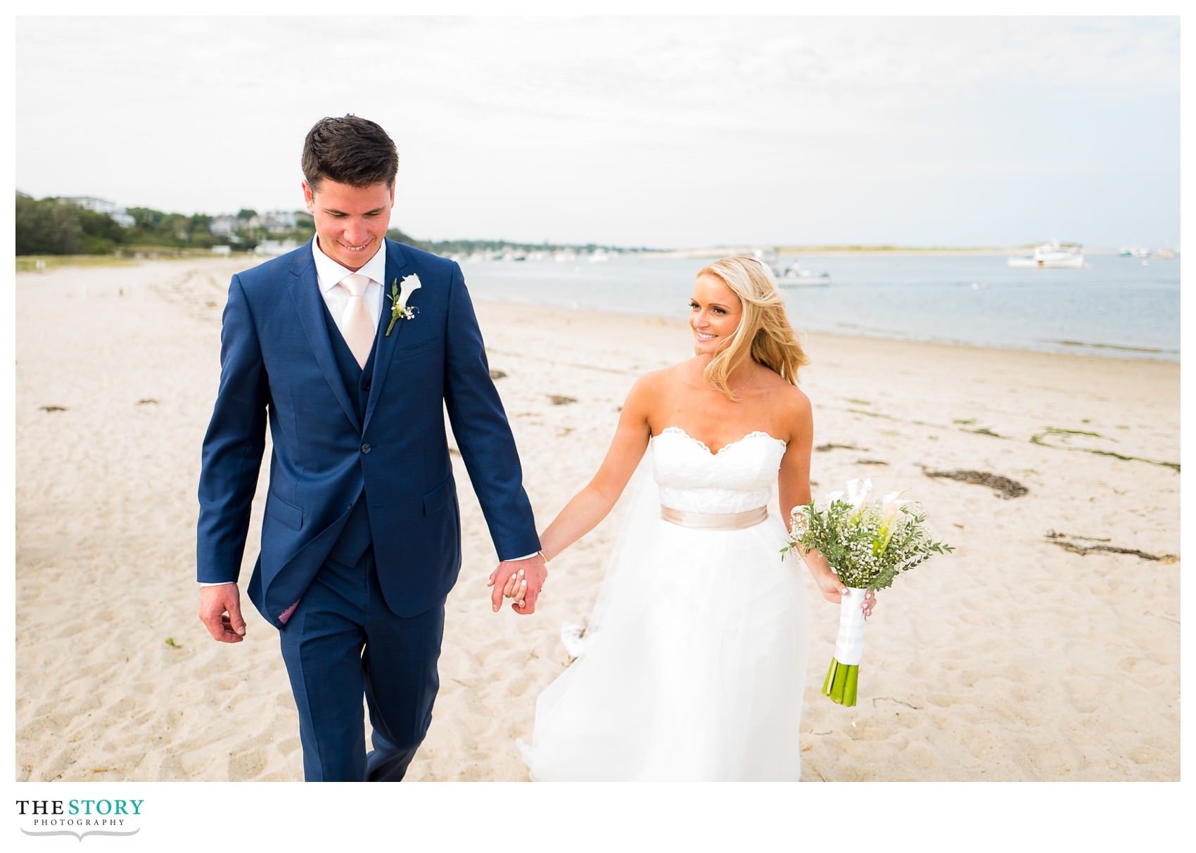 relaxed and candid wedding portraits on beach at Chatham Bars Inn